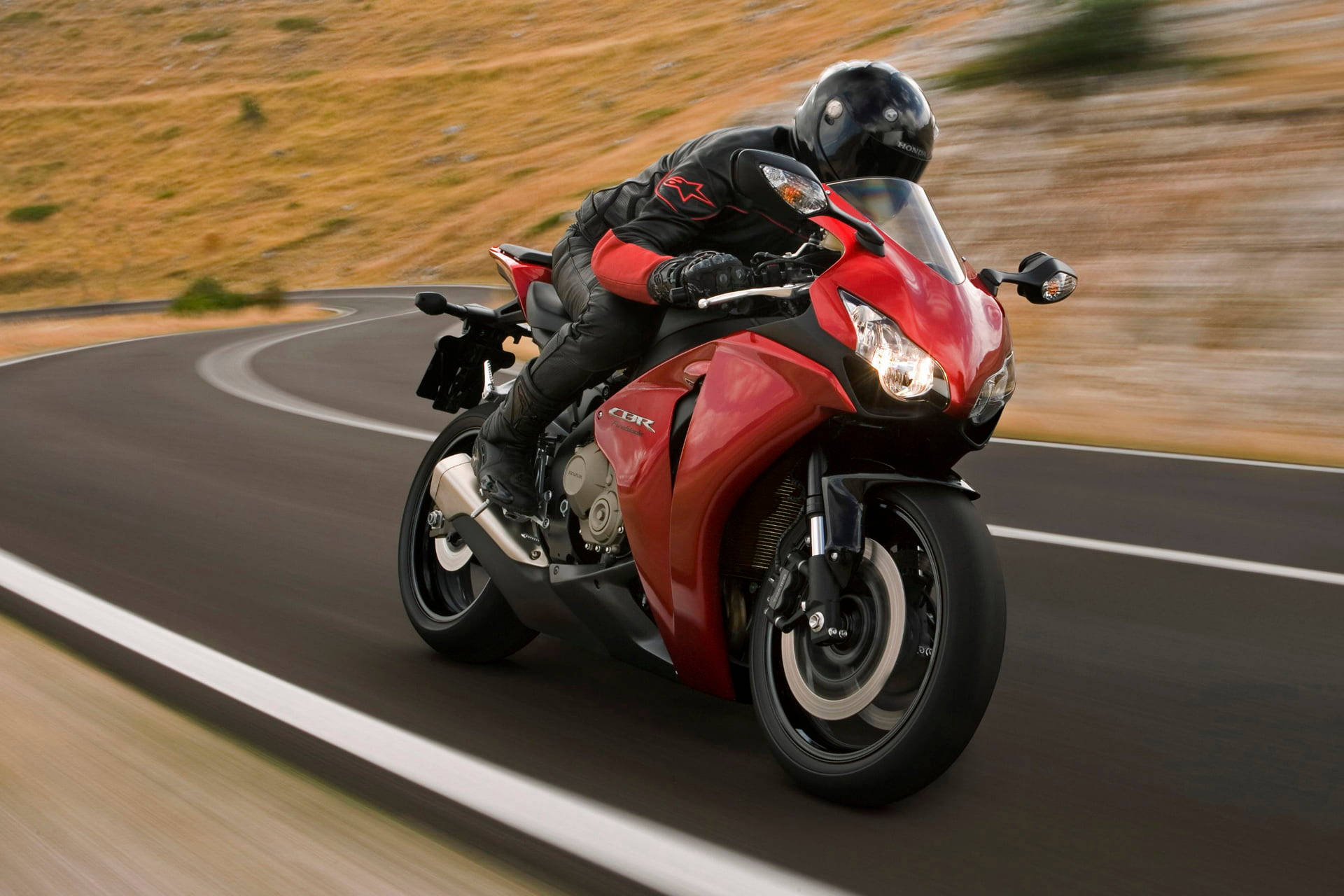 Honda Fireblade Red Bike In Action Background