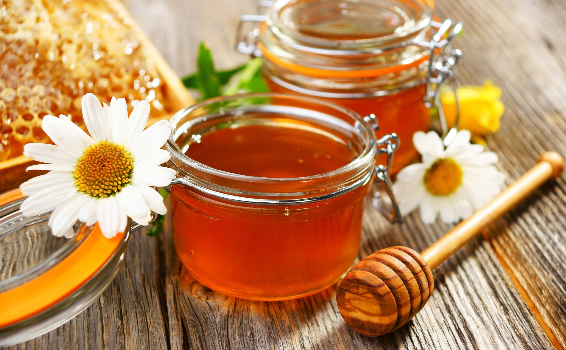 Honey Jars With White Flowers Background