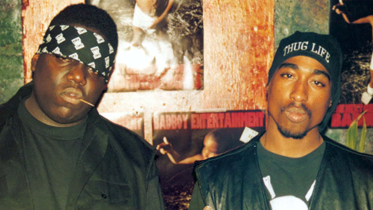 Honoring The Fallen: Dead Rappers Who Made An Impact Background