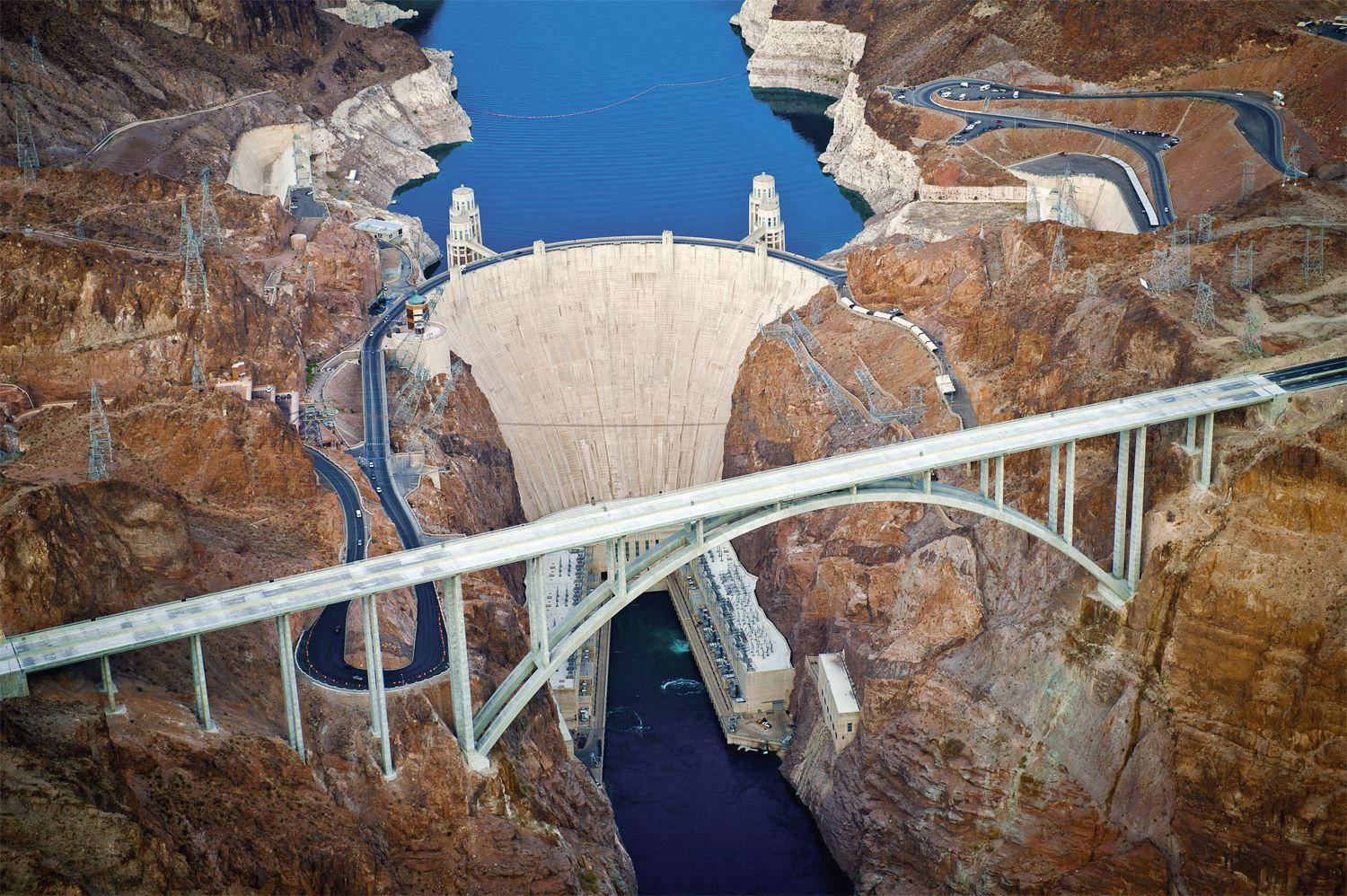 Hoover Dam Bridge And Winding Roads Background