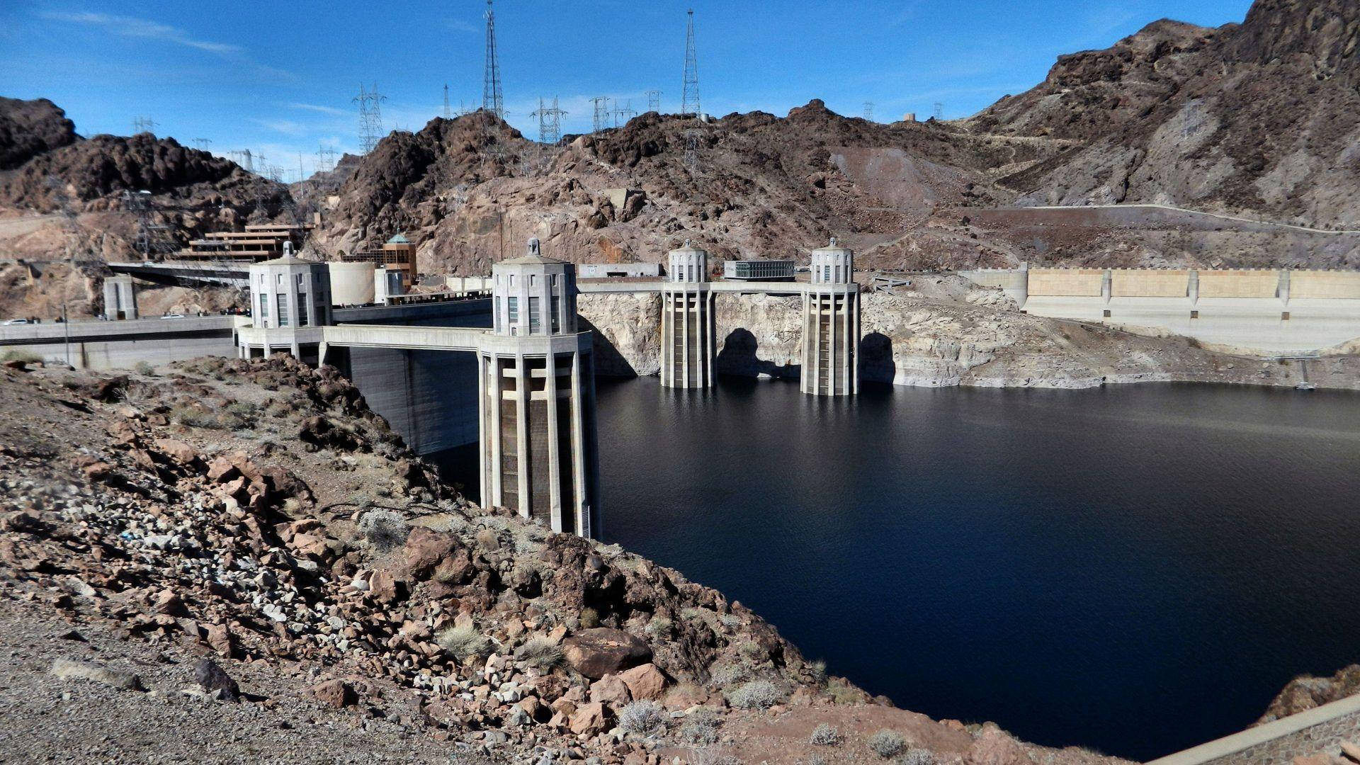 Hoover Dam In Rocky Terrain Background