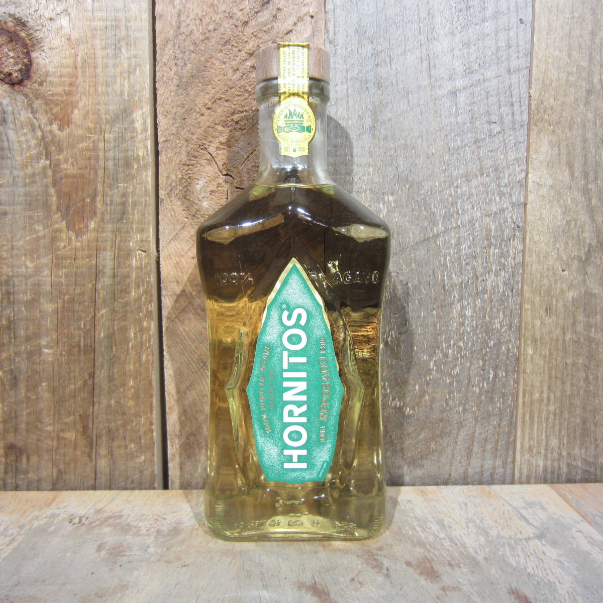 Hornitos Reposado Tequila On Light Wooden Background