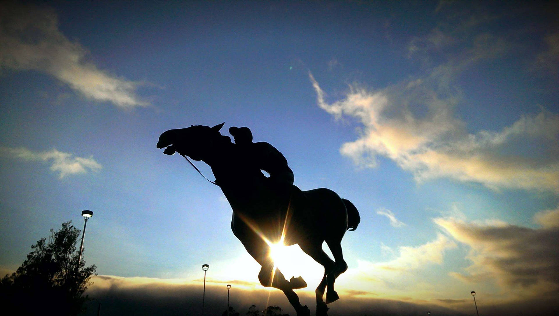 Horse Riding Silhouette Under The Sun Background