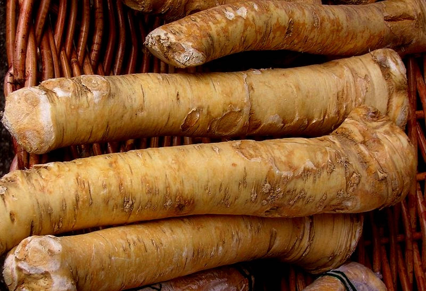 Horseradish In Brown Basket Background