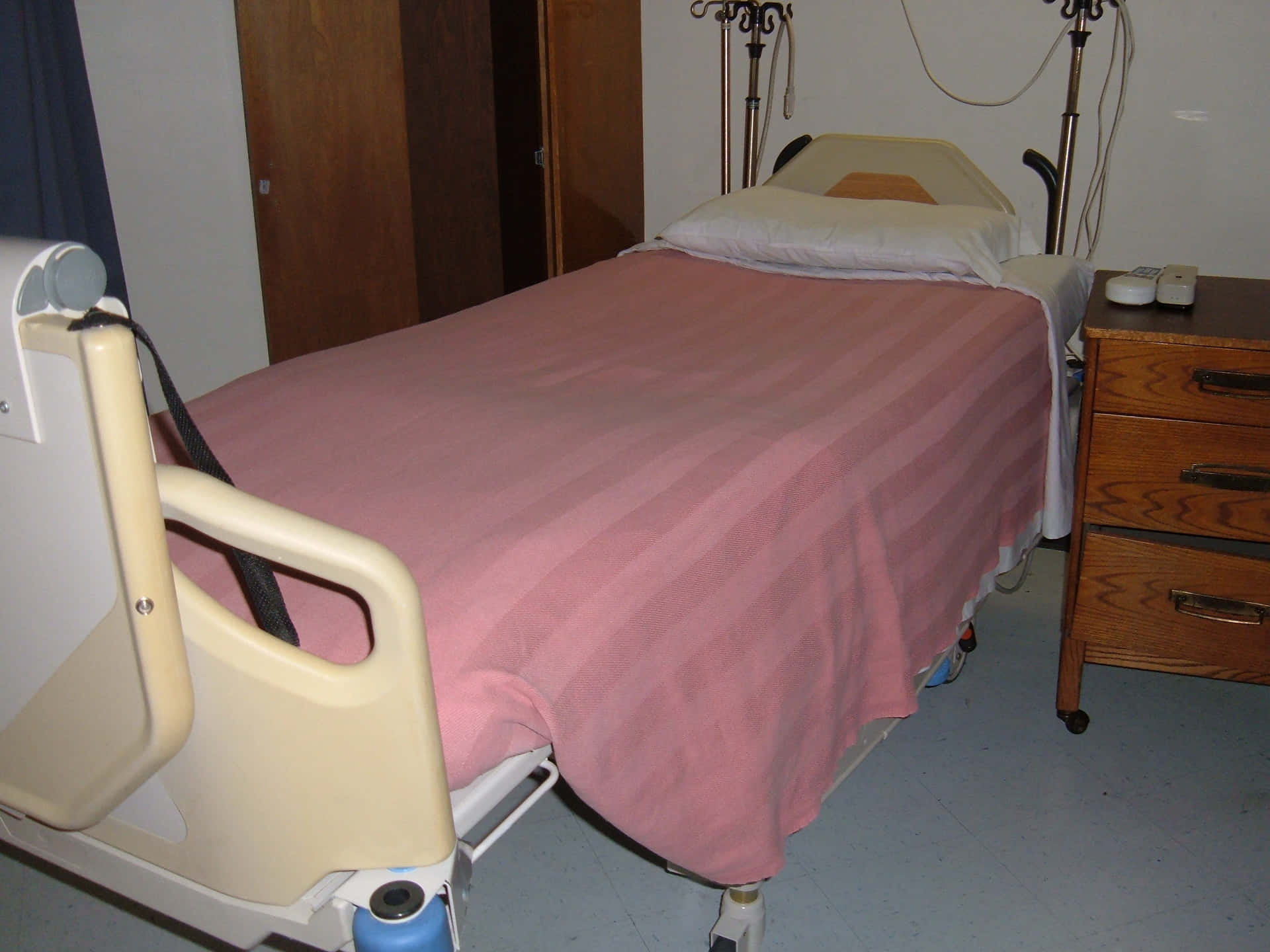 Hospital Bed With Pink Stripe Bedsheet