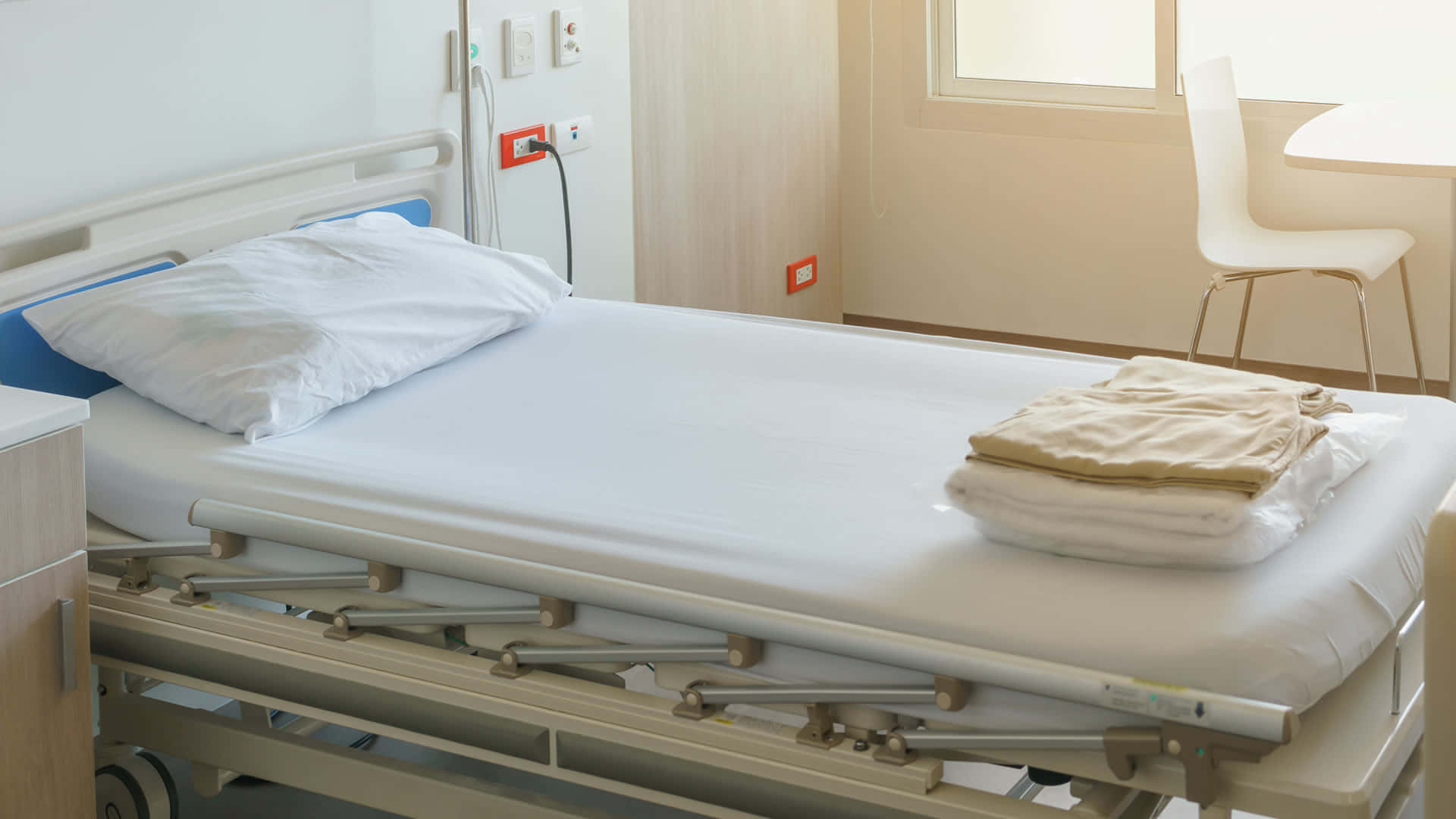 Hospital Bed With White Bedsheet Background