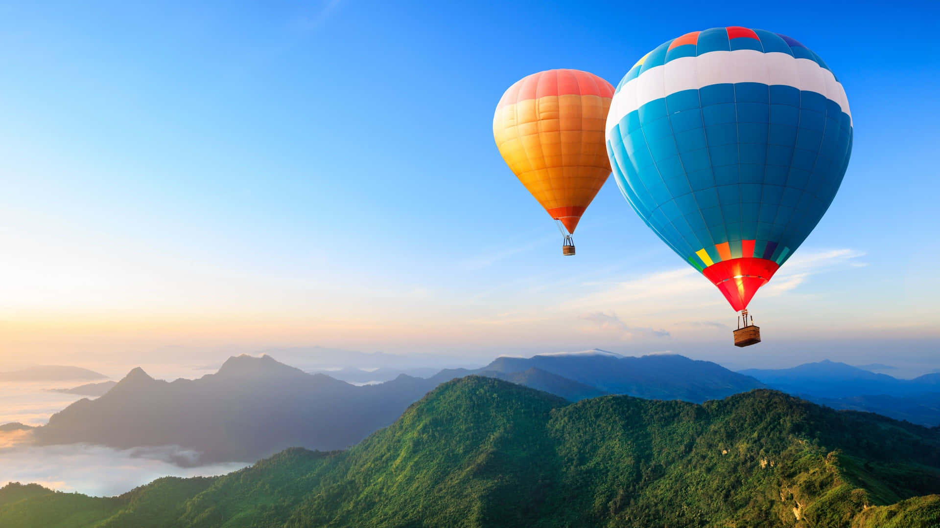 Hot Air Balloons Over Mountain Range Background