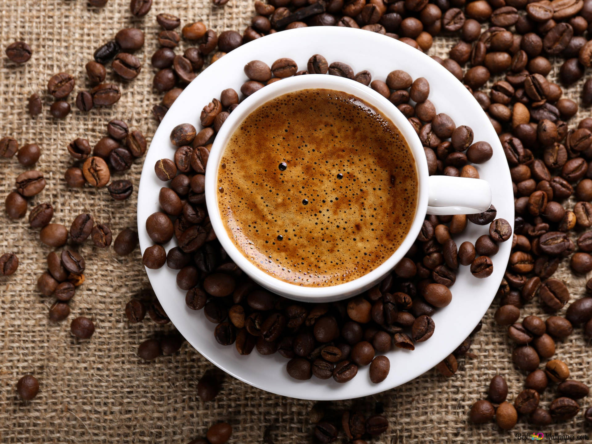 Hot Espresso Surrounded By Coffee Beans Background