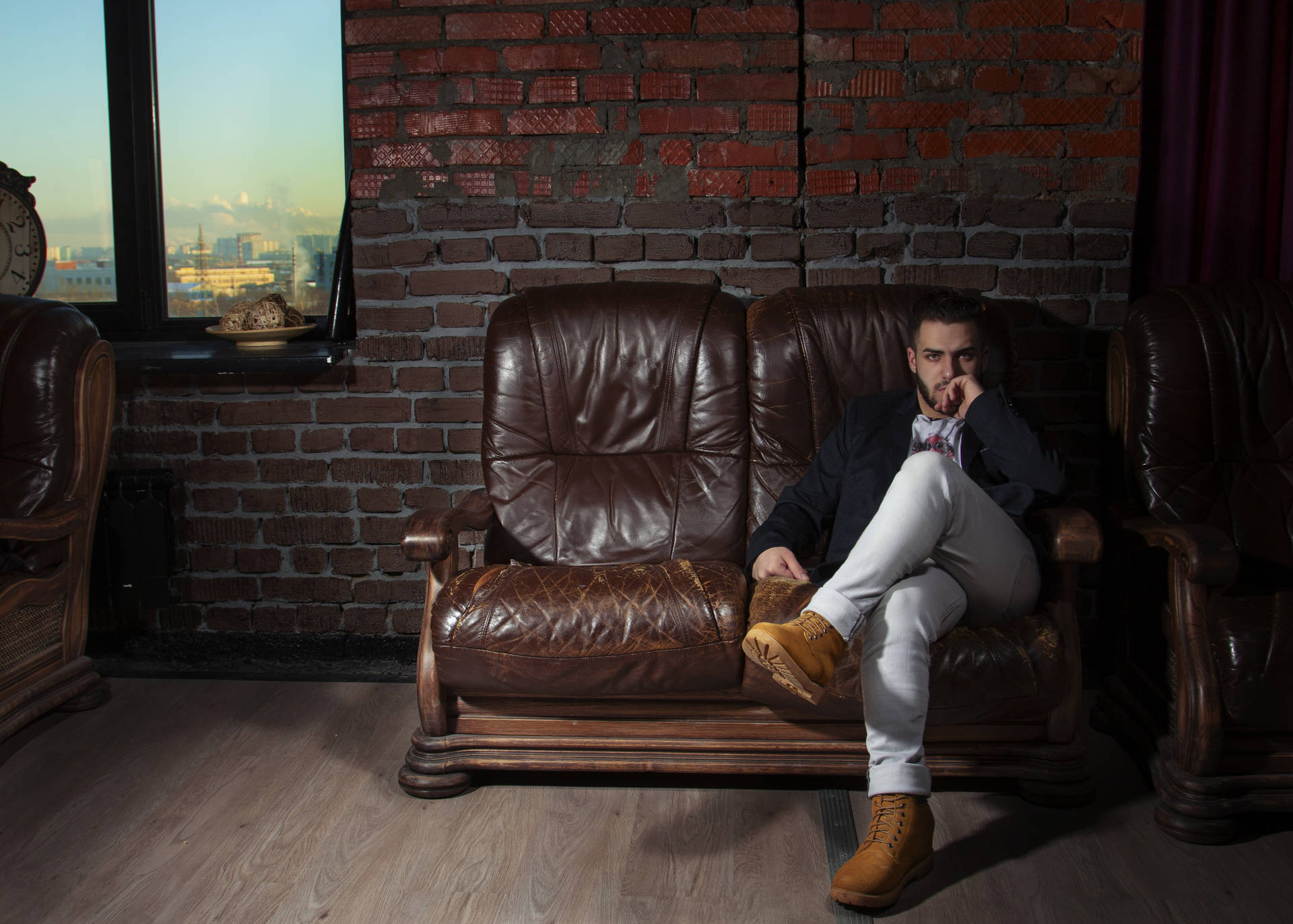 Hot Guy On Brown Couch Background