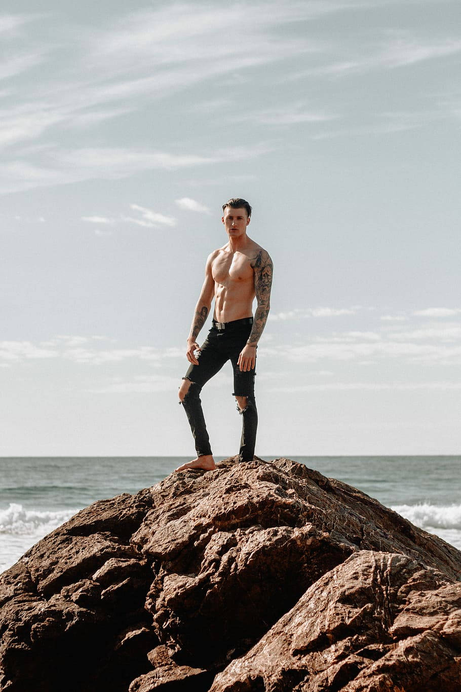 Hot Guy Rock Beach Background