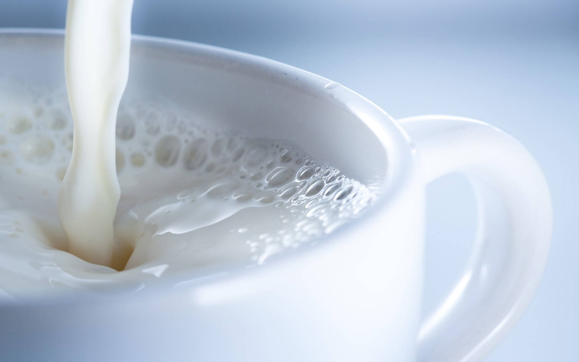 Hot Milk In A White Cup Background