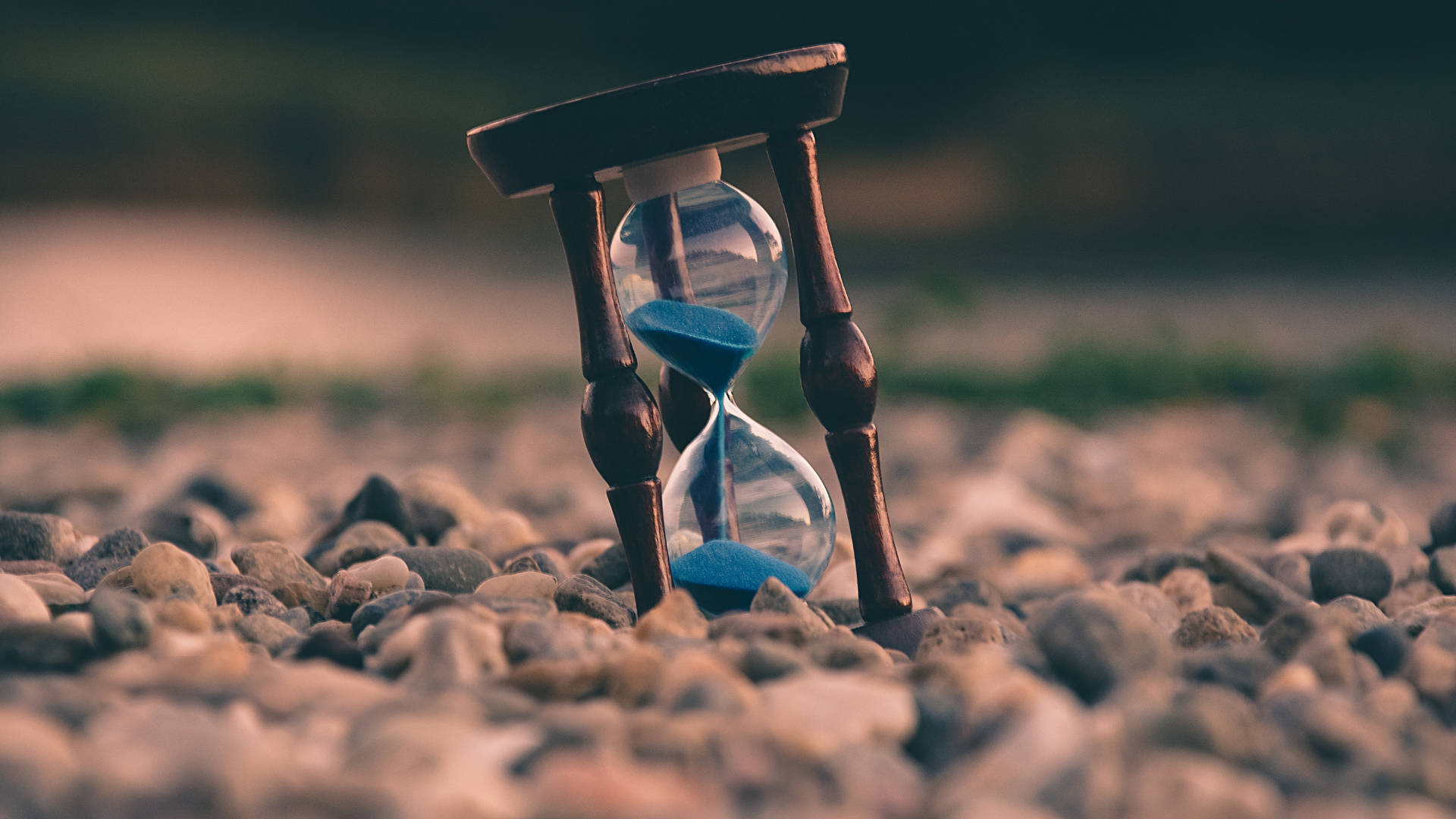 Hourglass On Rocks Tiempo Background Background