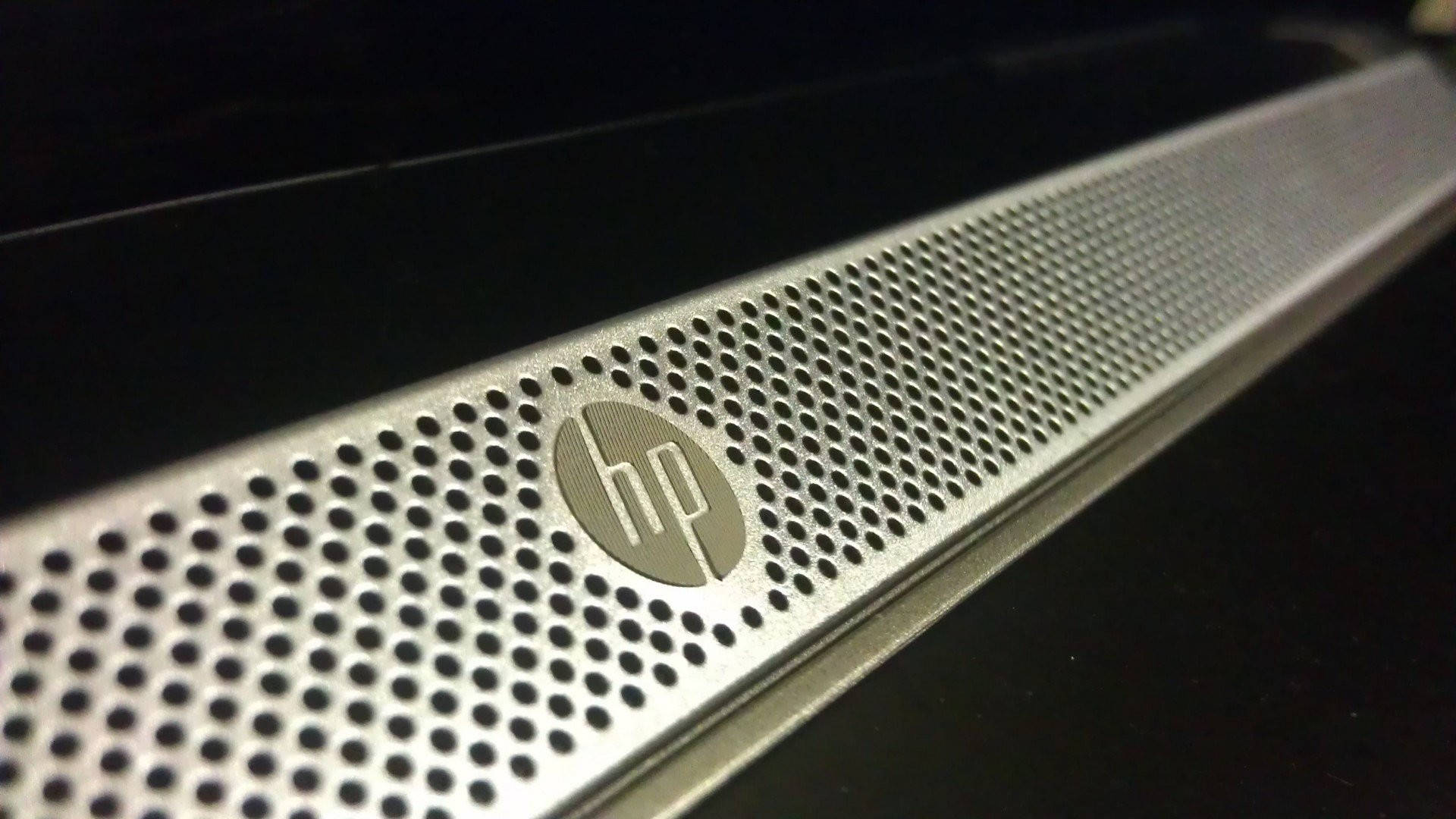 Hp Laptop Logo On Speaker Background