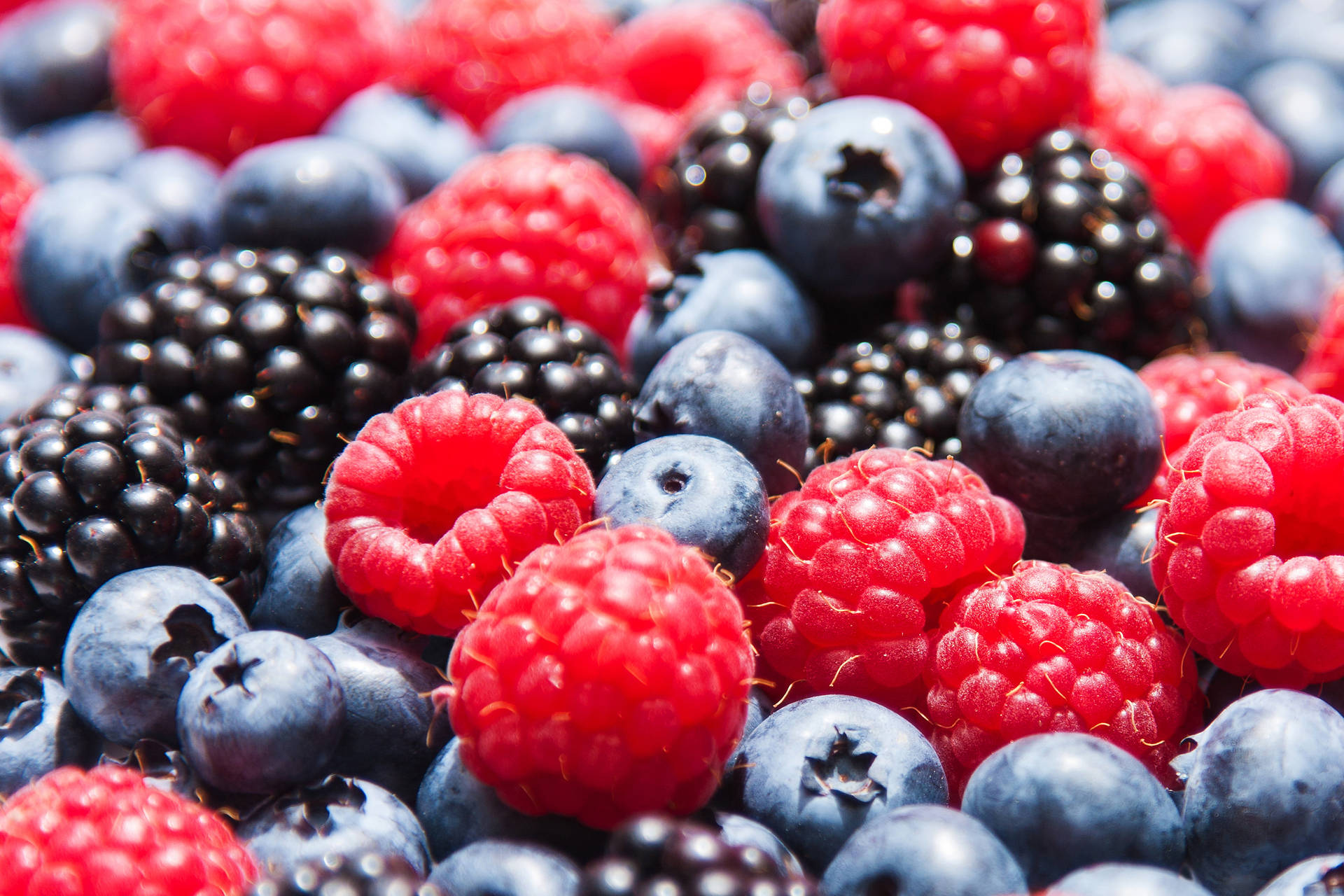 Huckleberry With Redberries And Blackberries Background