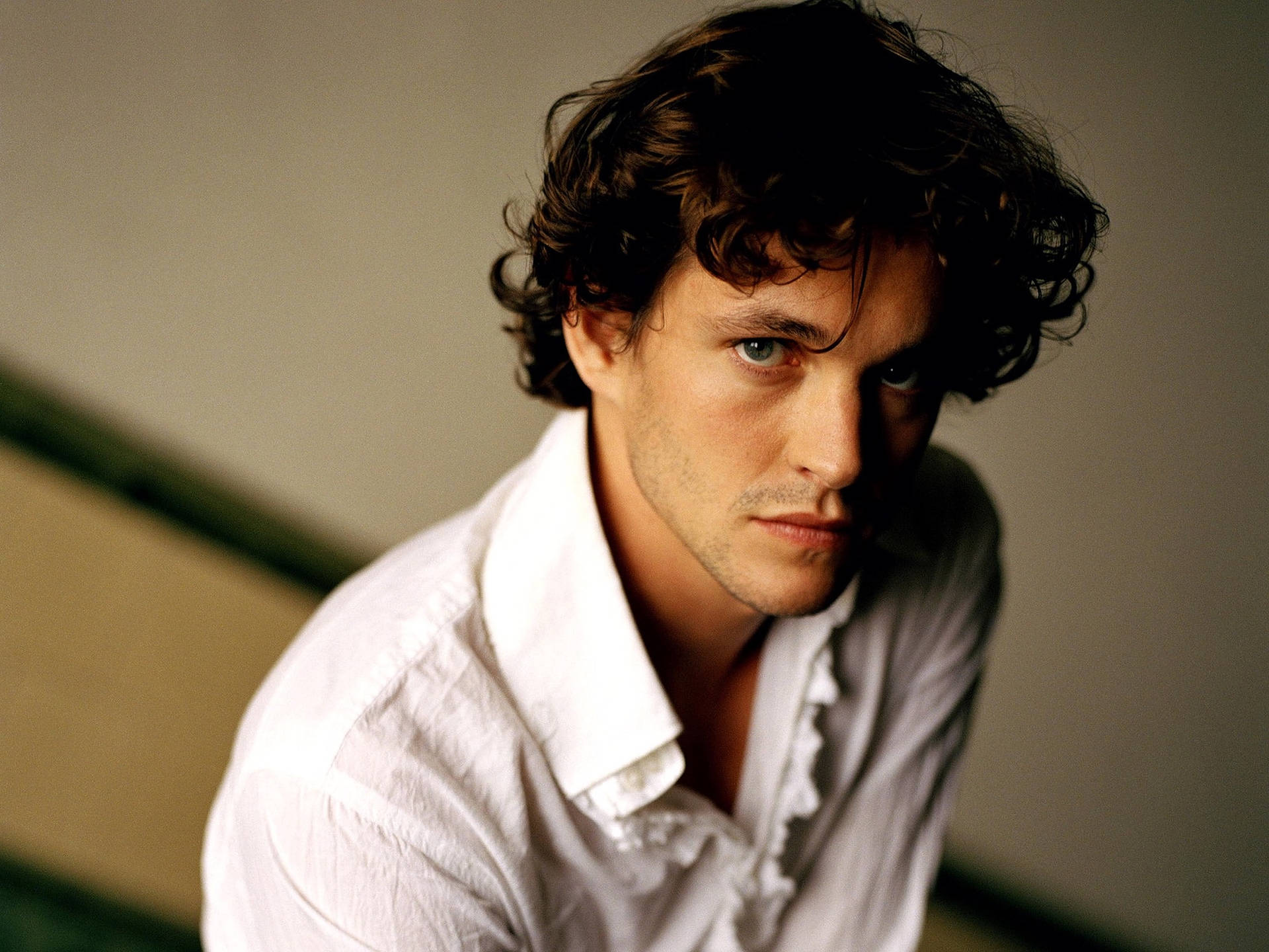 Hugh Dancy In White Outfit Background