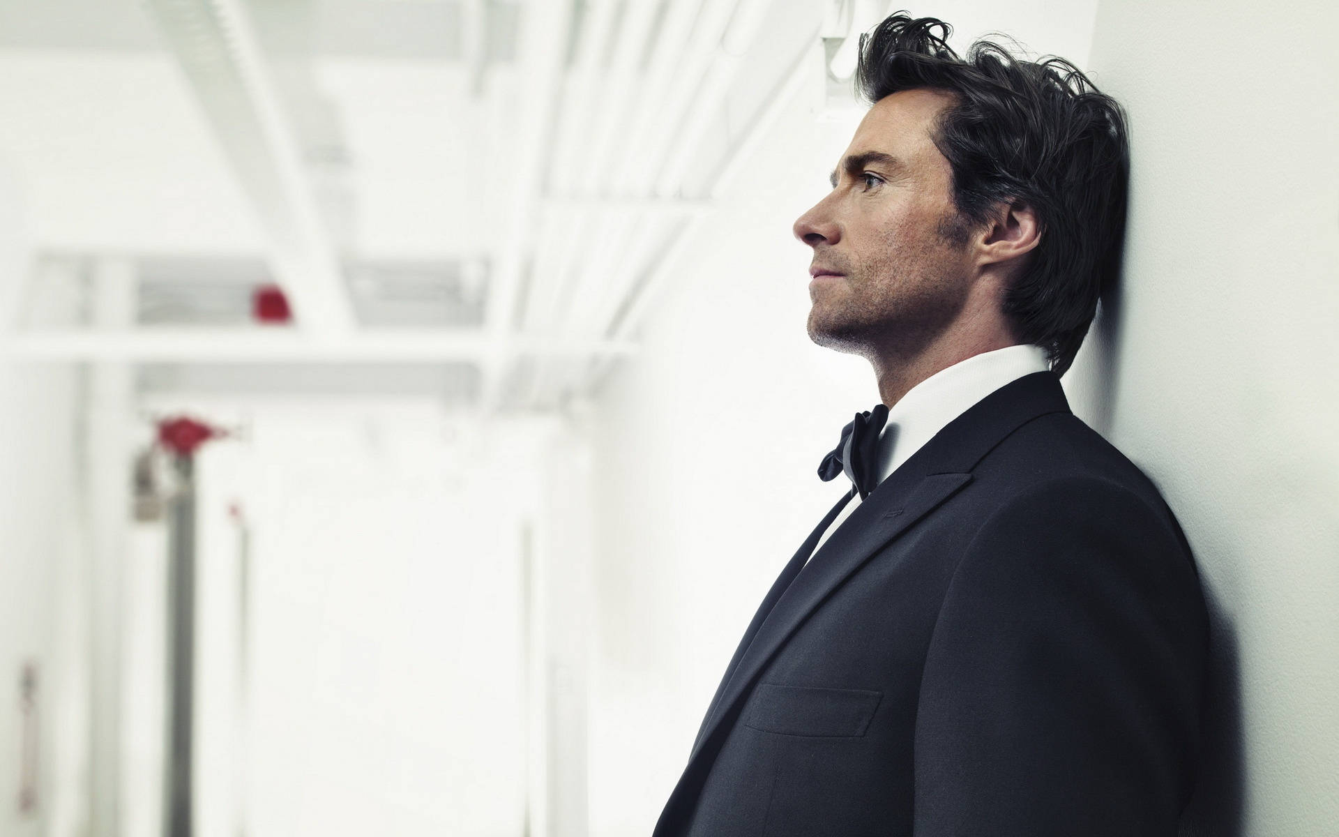 Hugh Jackman In Black Suit Background