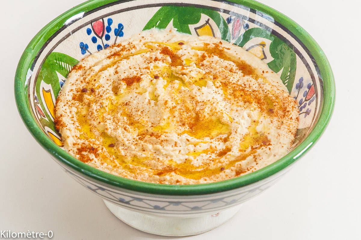 Hummus In Green And White Bowl Background