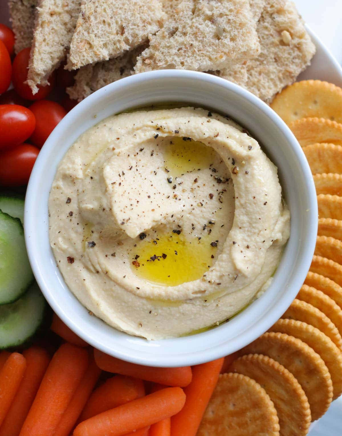 Hummus With Crackers And Vegetables Background