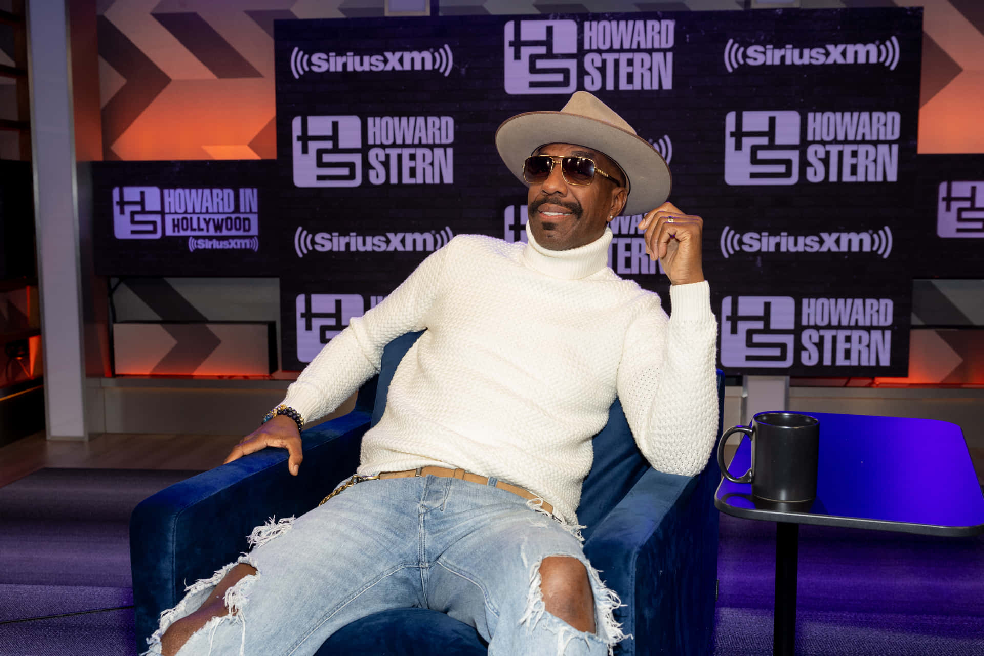 Humorous Comedian J.b. Smoove Shining On Stage Background