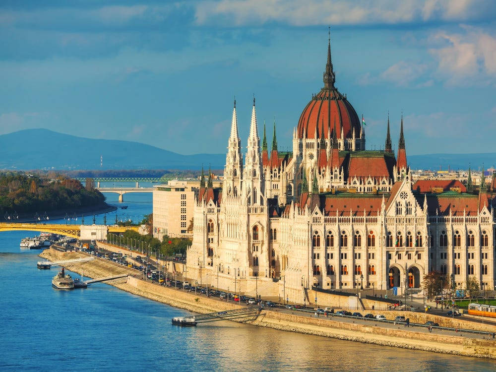 Hungary's Parliament Building Is Seen From The River Background