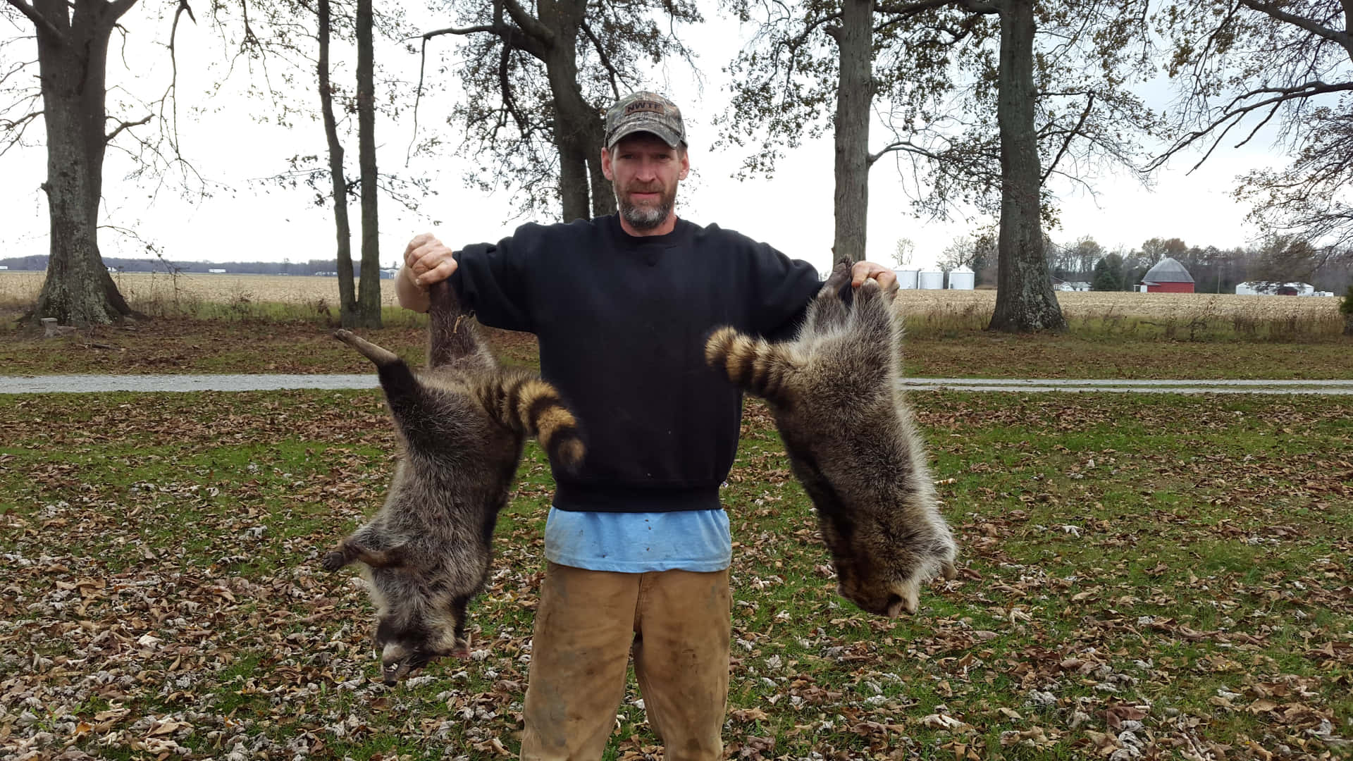 Hunter_with_ Raccoon_ Trophies Background