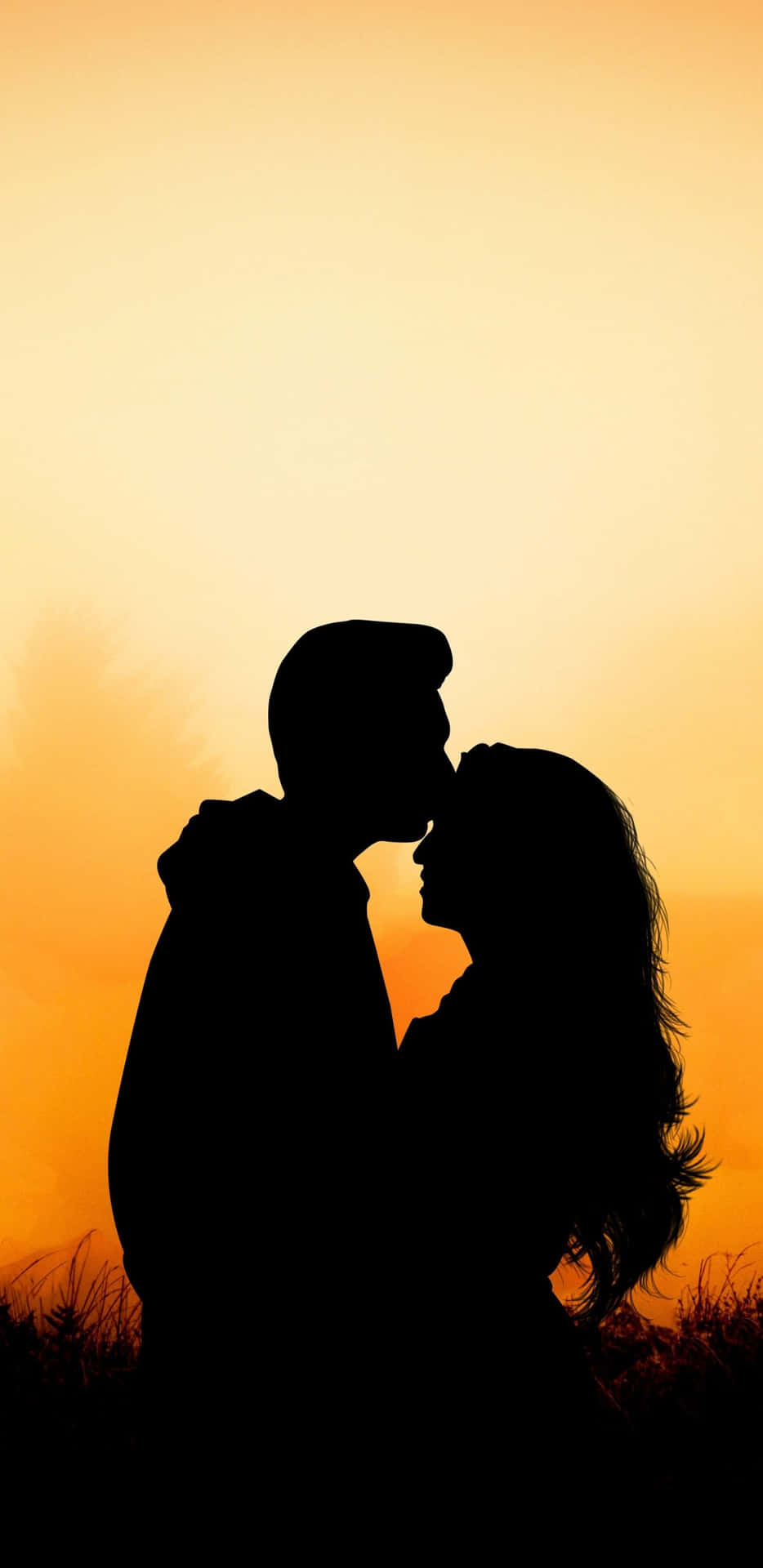 Husband And Wife Forehead Kiss Sunset Background