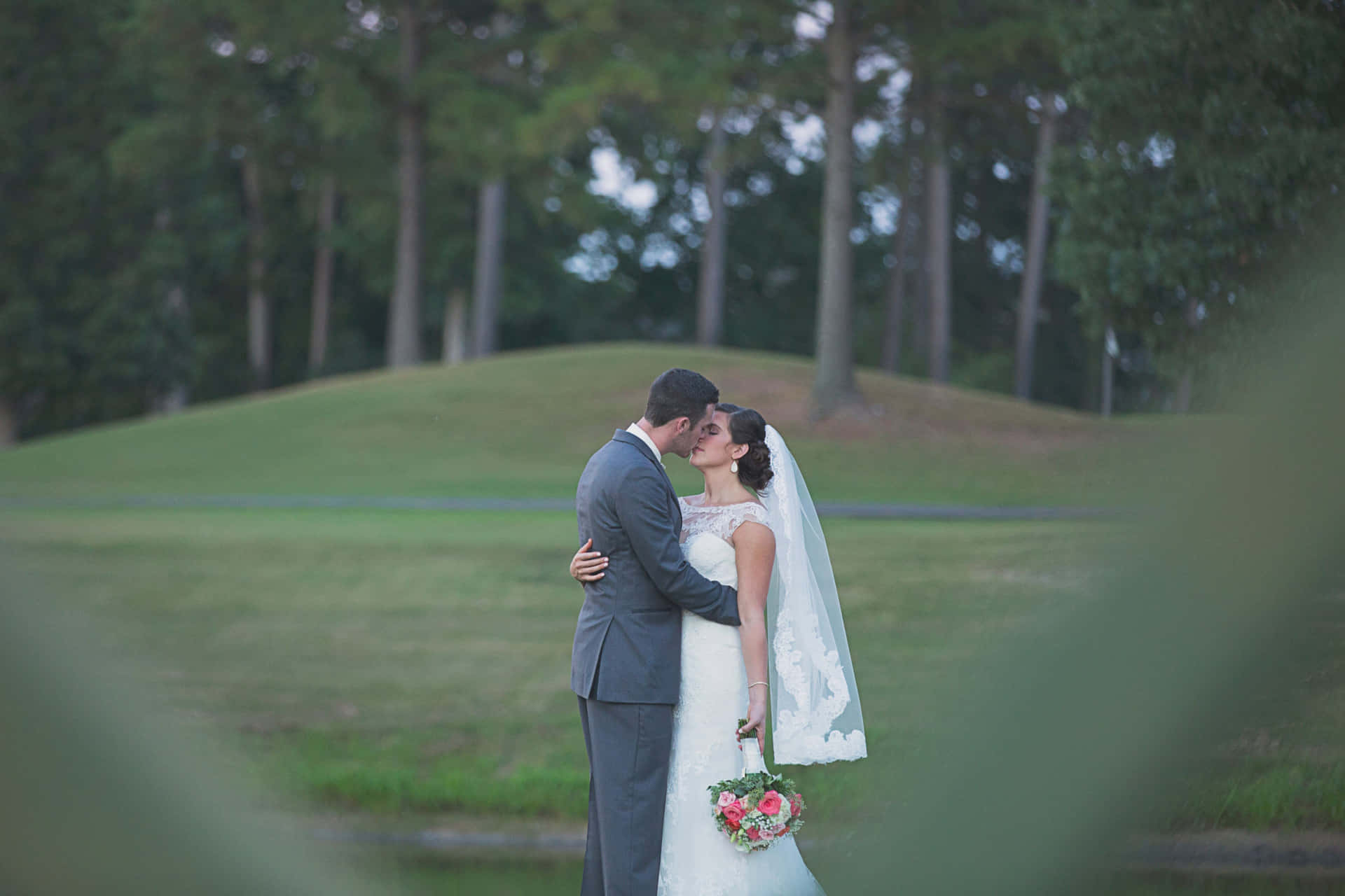 Husband And Wife Married Kissing On Grass Background