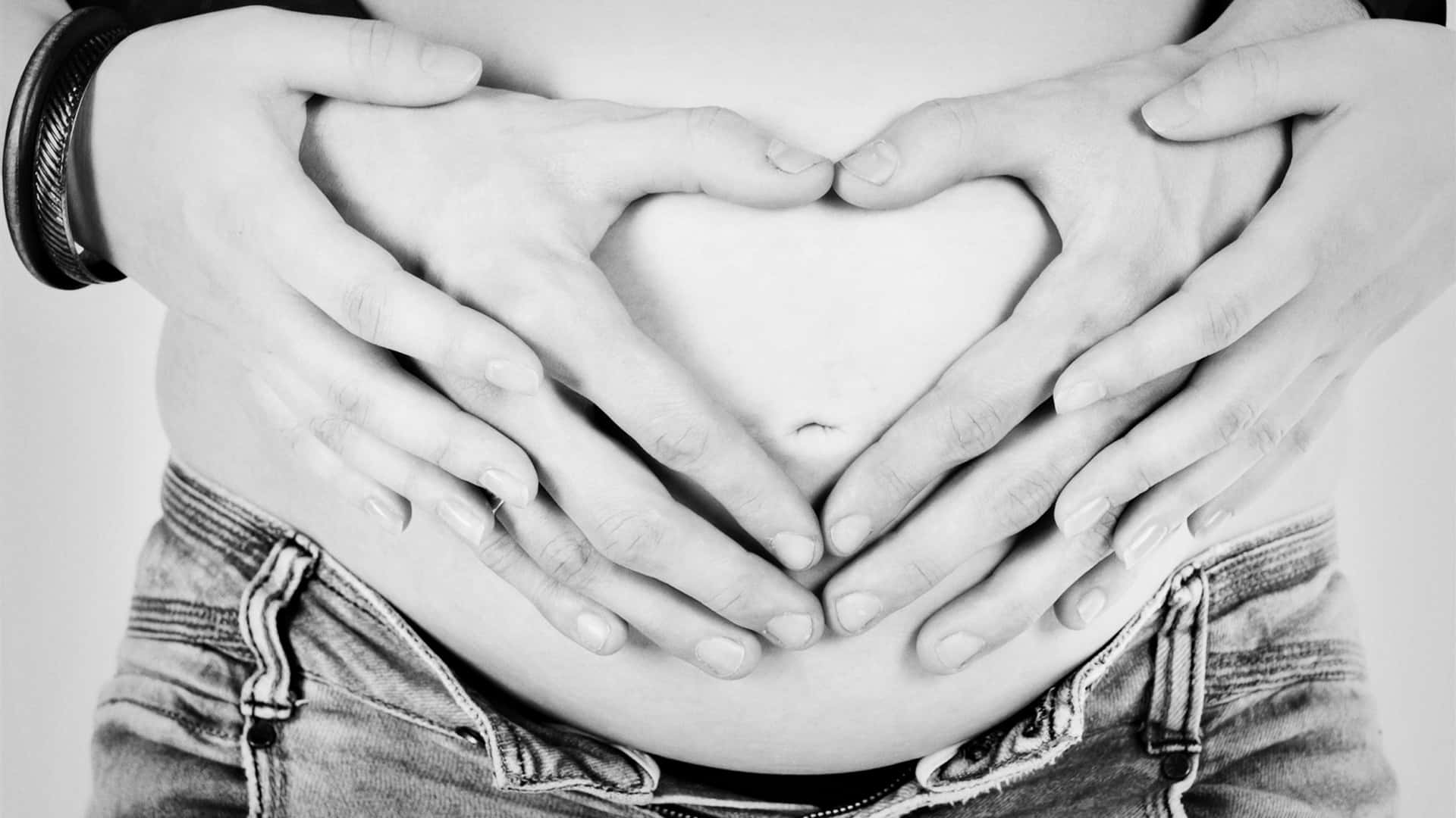 Husband And Wife Pregnant Hand Heart