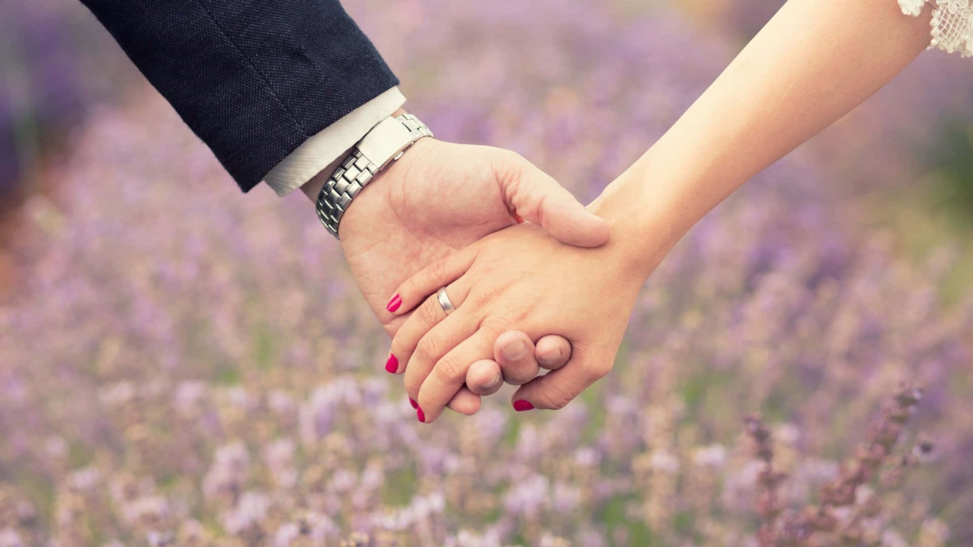 Husband And Wife Wedding Holding Hands Flowers Background