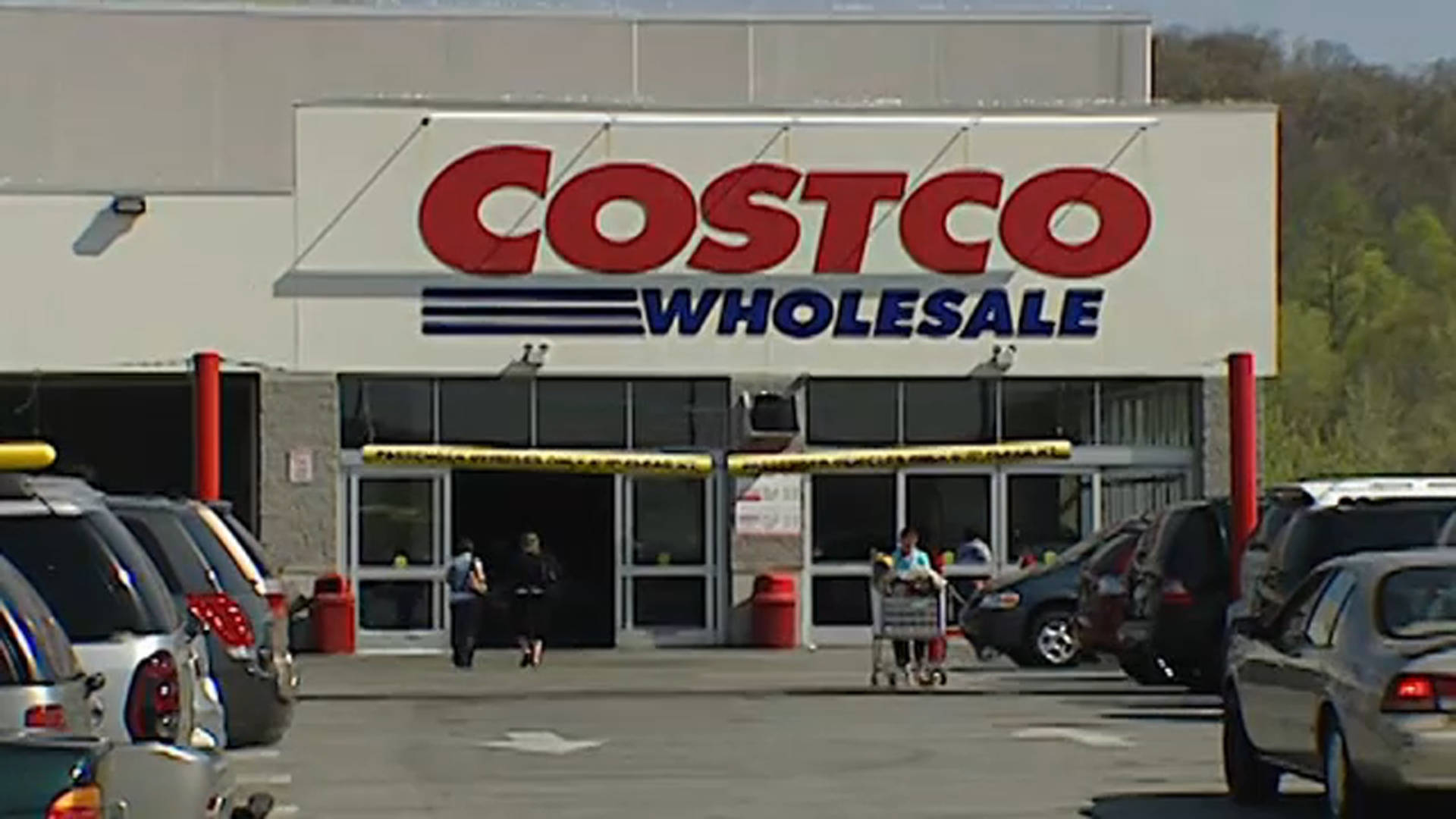 Hustle And Bustle At Costco Wholesale Parking Lot Background