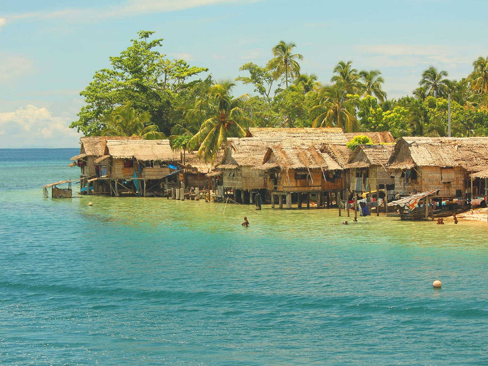 Huts By The Solomon Islands Sea Background