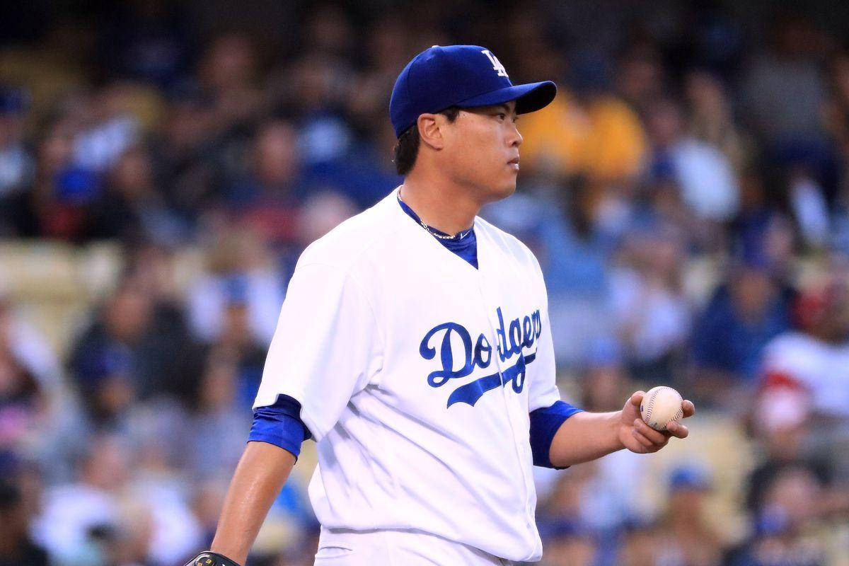 Hyun Jin Ryu Confidently Holding A Baseball In One Hand Background