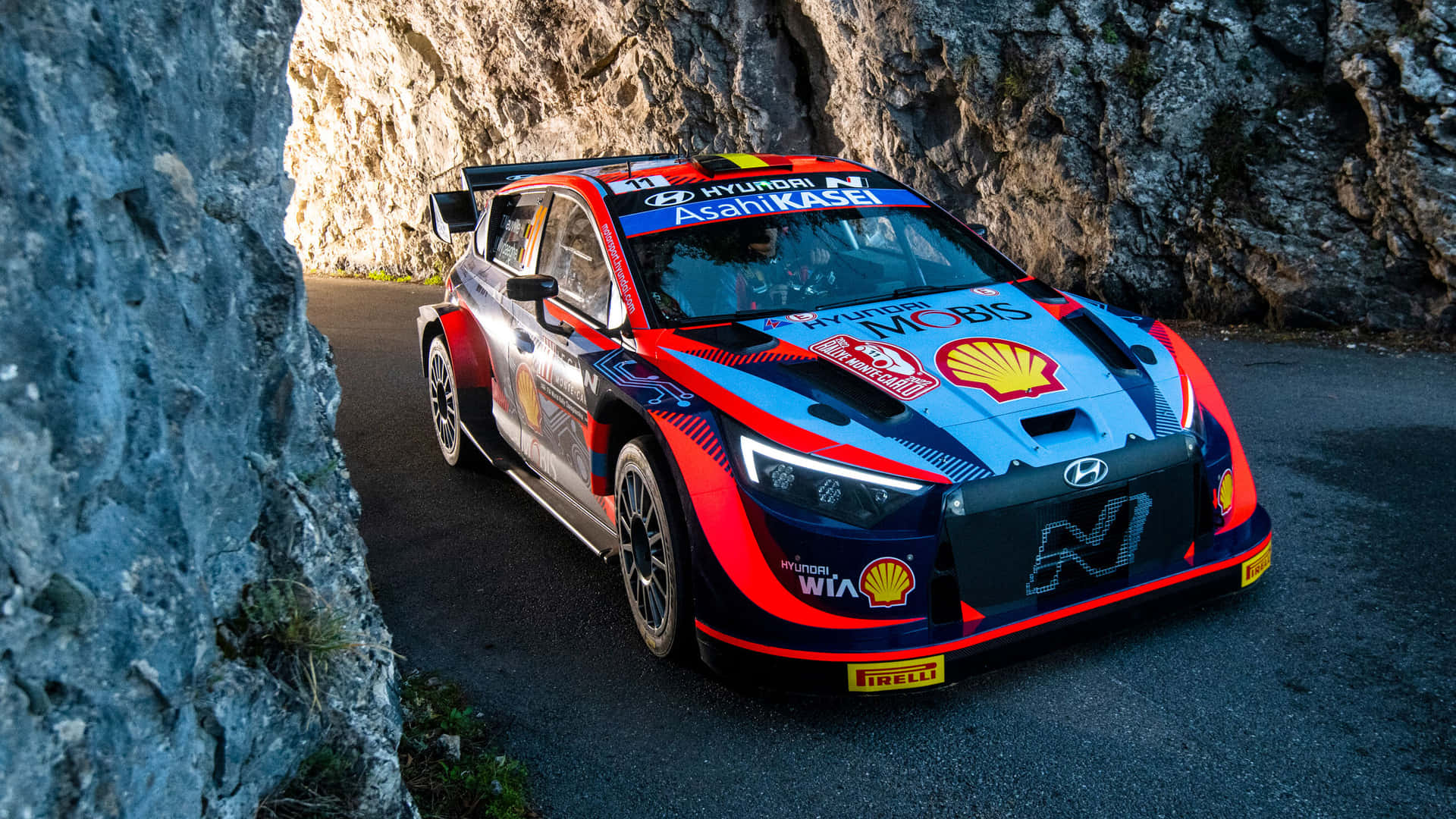 Hyundai Rally Car Speeding Through Mountain Pass.jpg