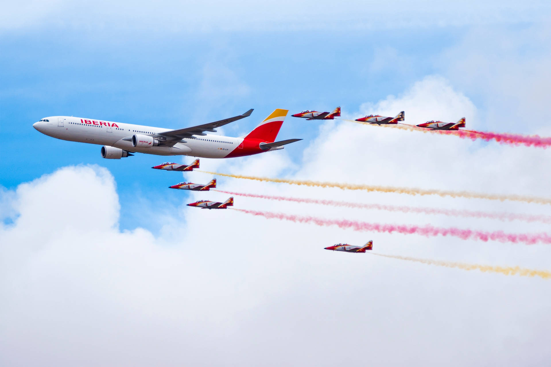 Iberia Airlines Aircrafts With Colorful Smoke Background