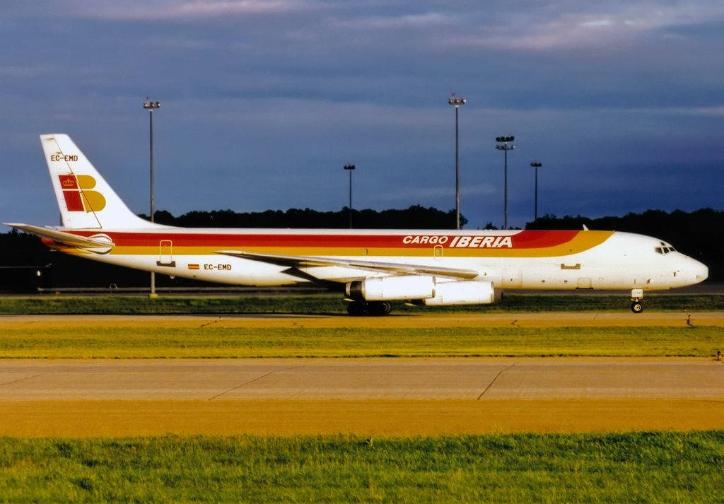 Iberia Airlines Airplane On Green Runway Background