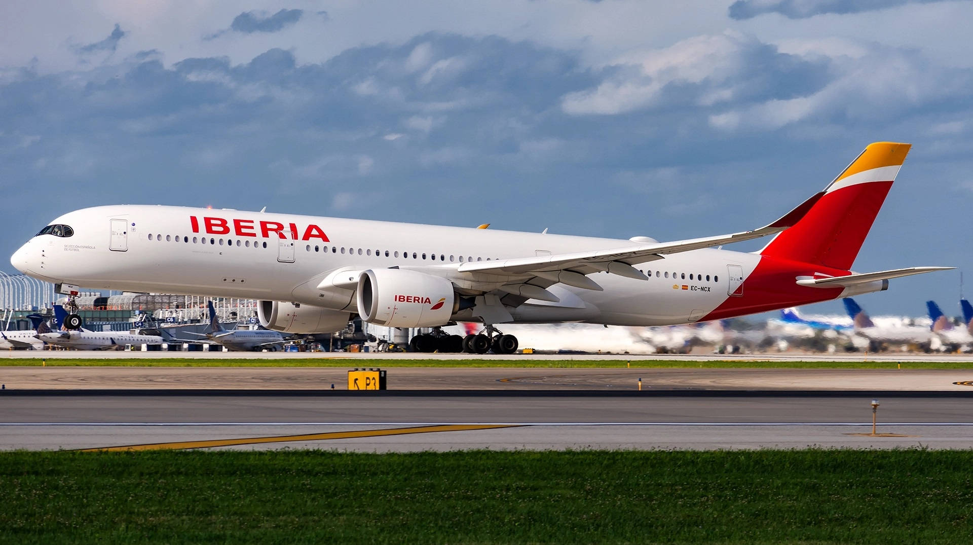 Iberia Airlines Airplanes On Busy Airport Background