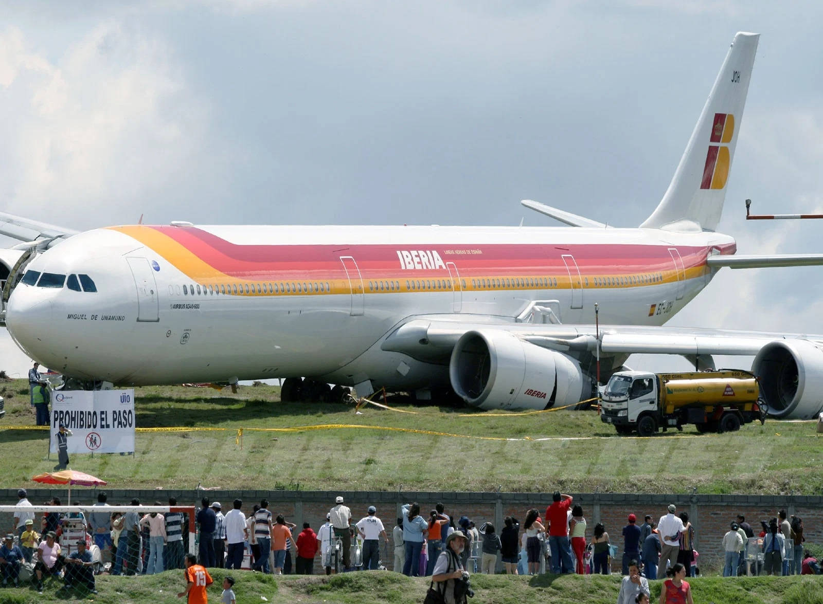 Iberia Airlines Crashed Airplane With Curious Crowd Background