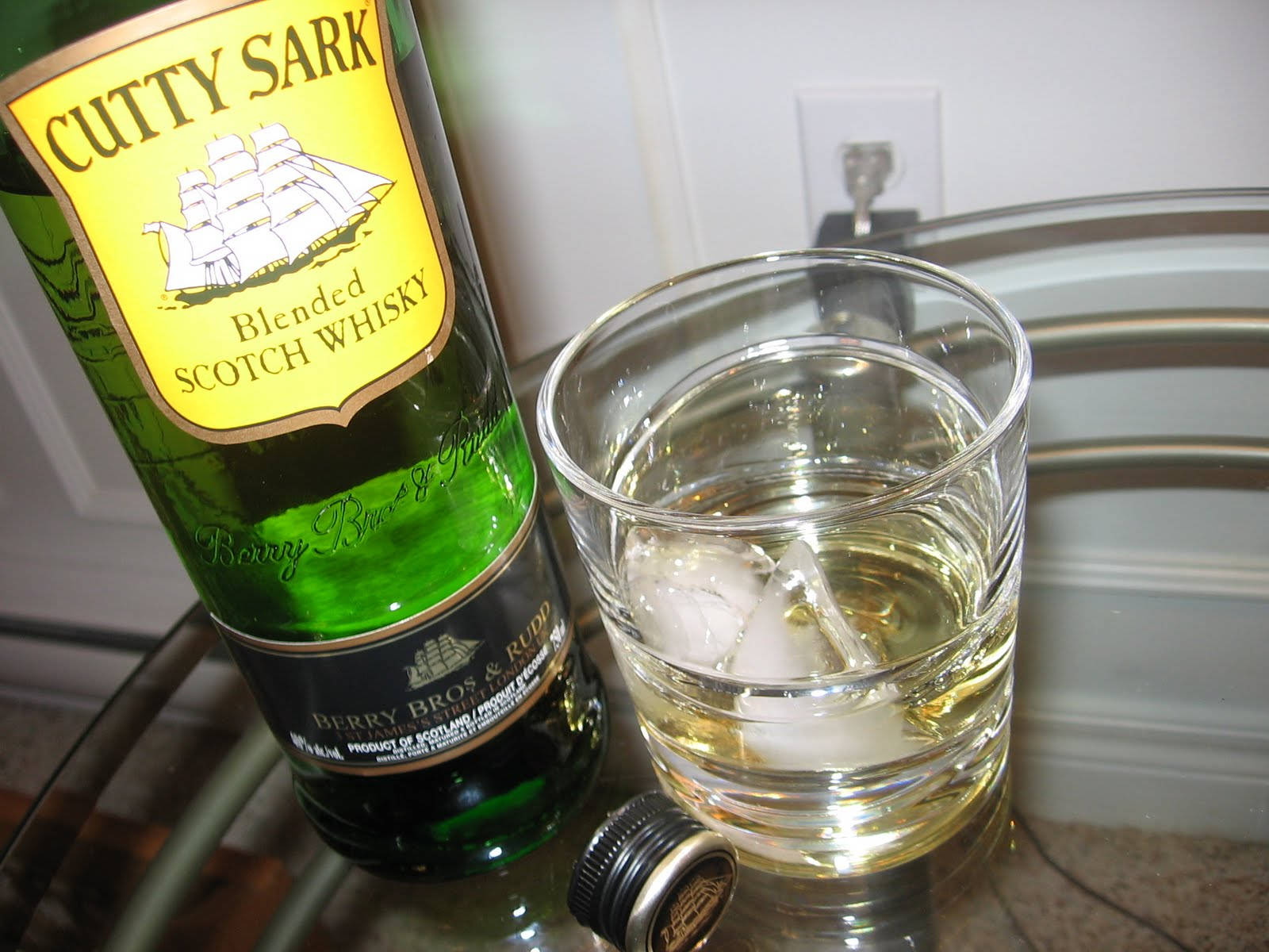 Ice Cold Glass Of Cutty Sark Whiskey Background