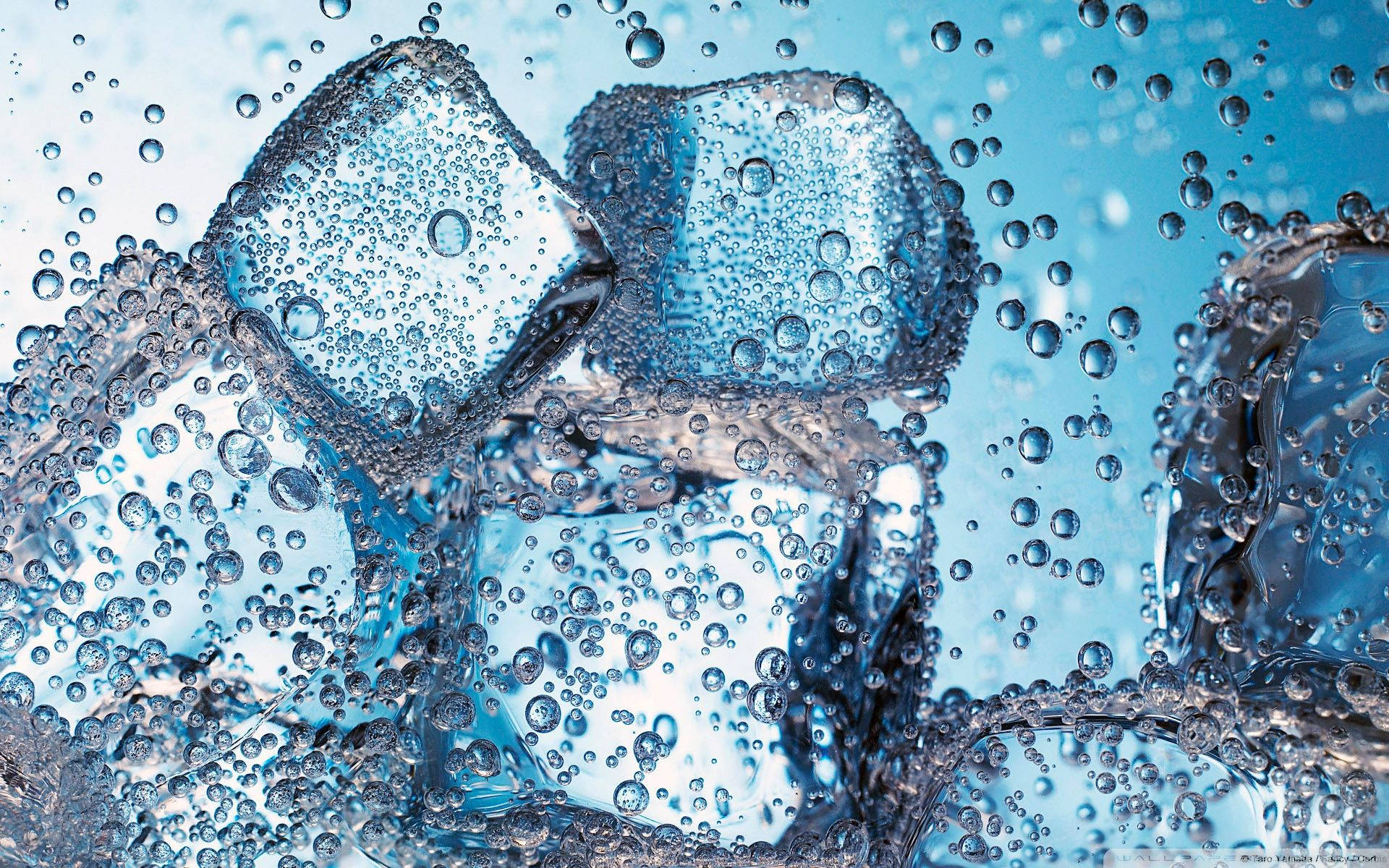 Ice Cubes In Fizzy Water Background