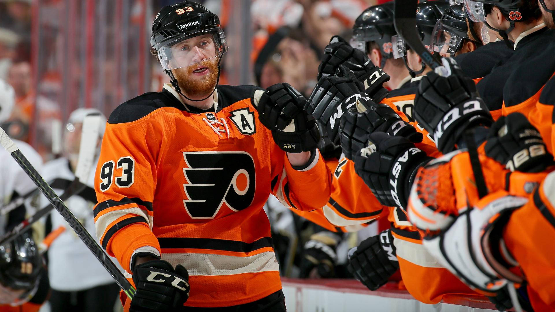 Ice Hockey Player Jakub Voracek Fist Bump With Teammates Background