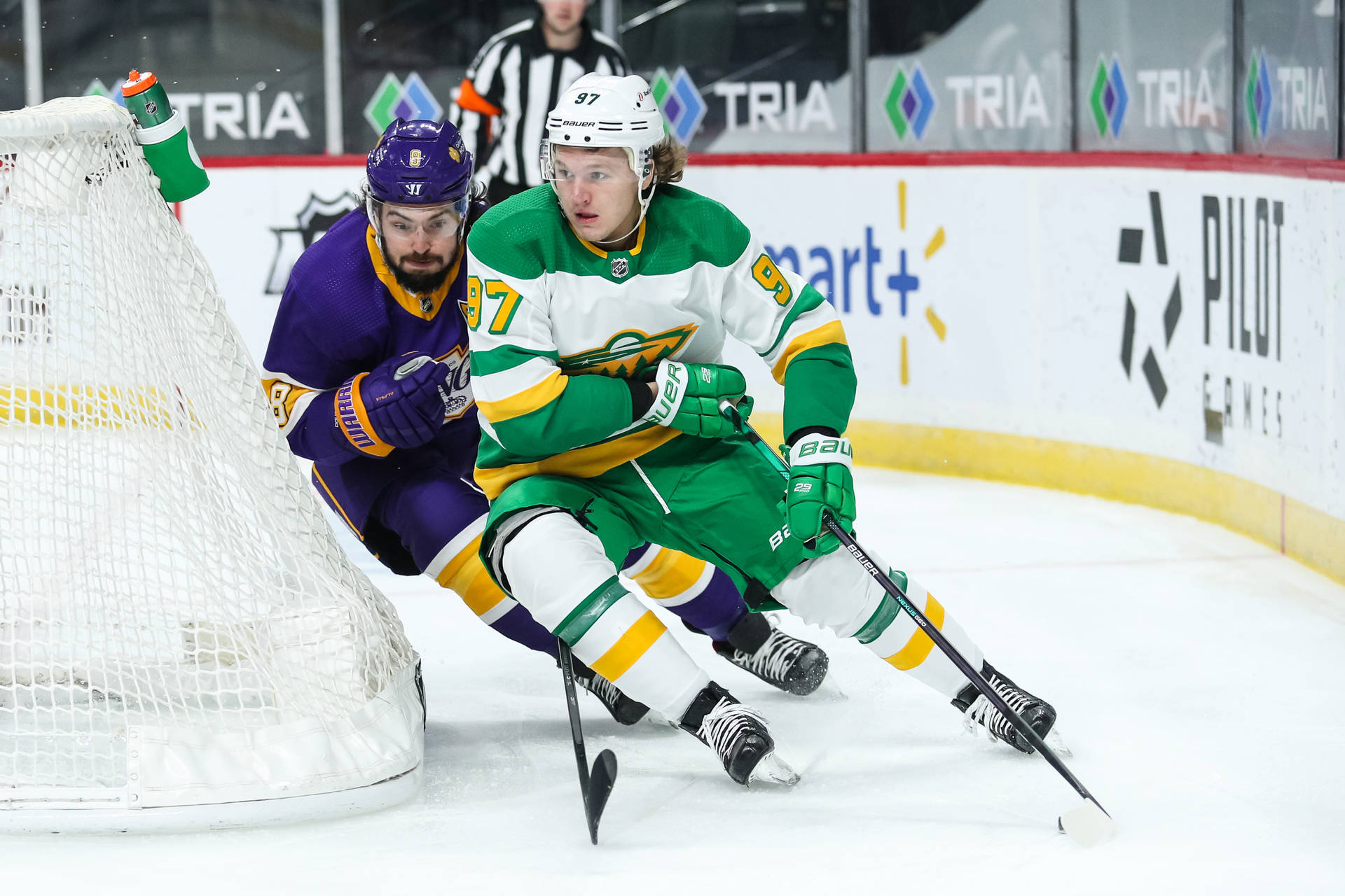 Ice Hockey Star Kirill Kaprizov Maneuvering Background