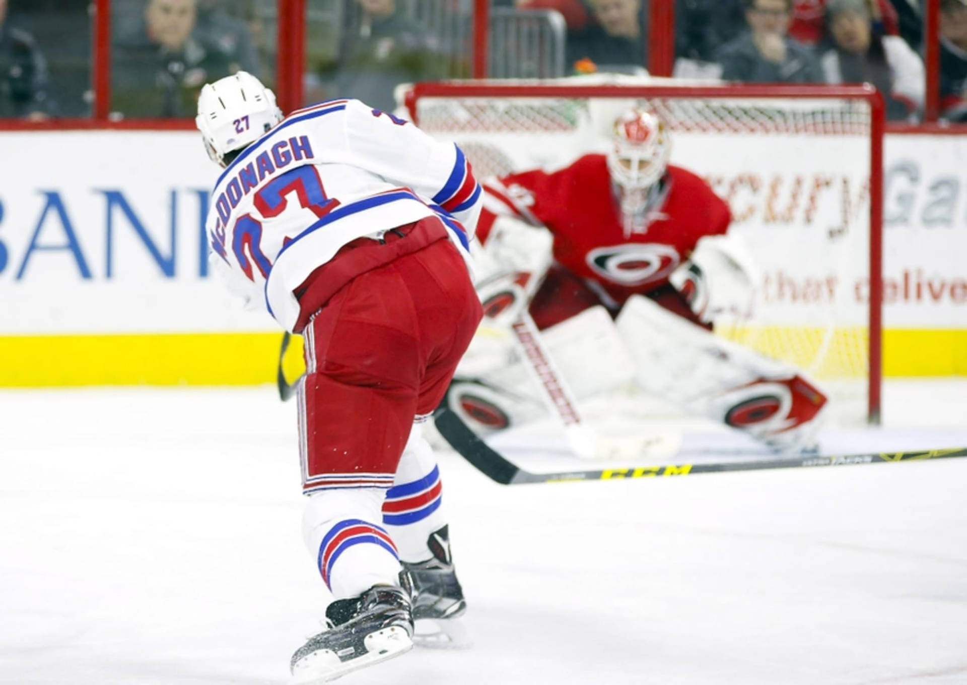 Ice Hockey Star Ryan Mcdonagh In Action Against Carolina Hurricanes Background