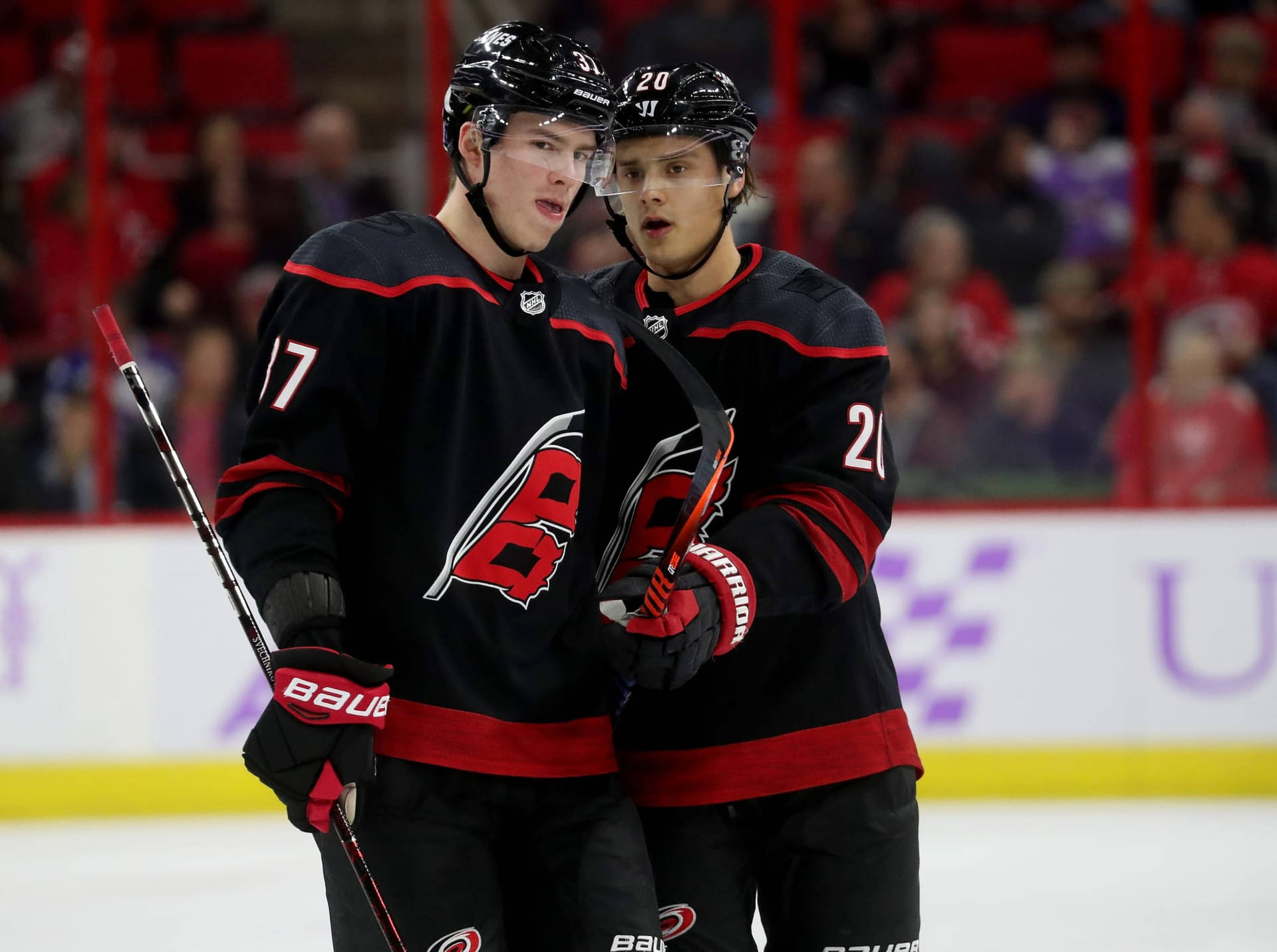 Ice Hockey Superstars Sebastian Aho And Andrei Svechnikov In Action Background