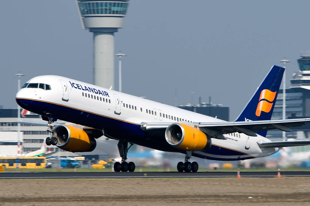 Icelandair Airplane Takes To The Skies Background