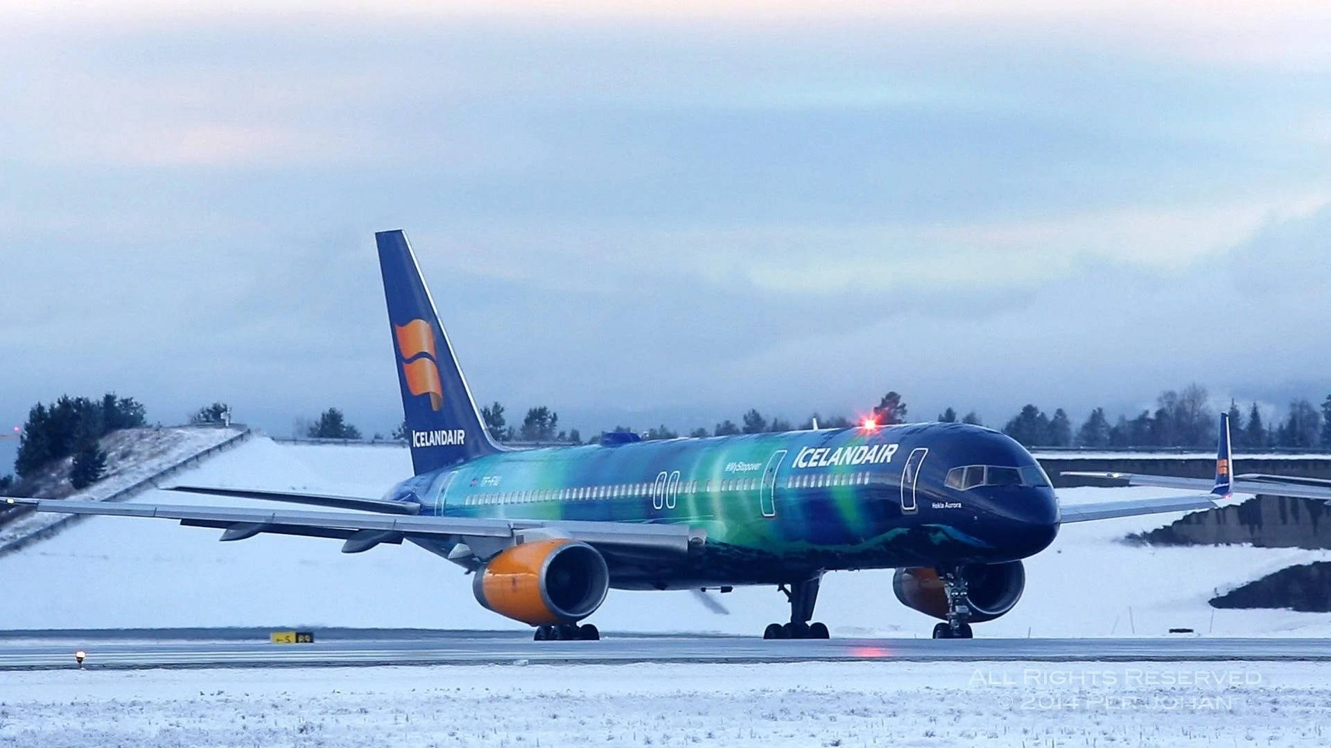 Icelandair Blue Airplane On Runway Background