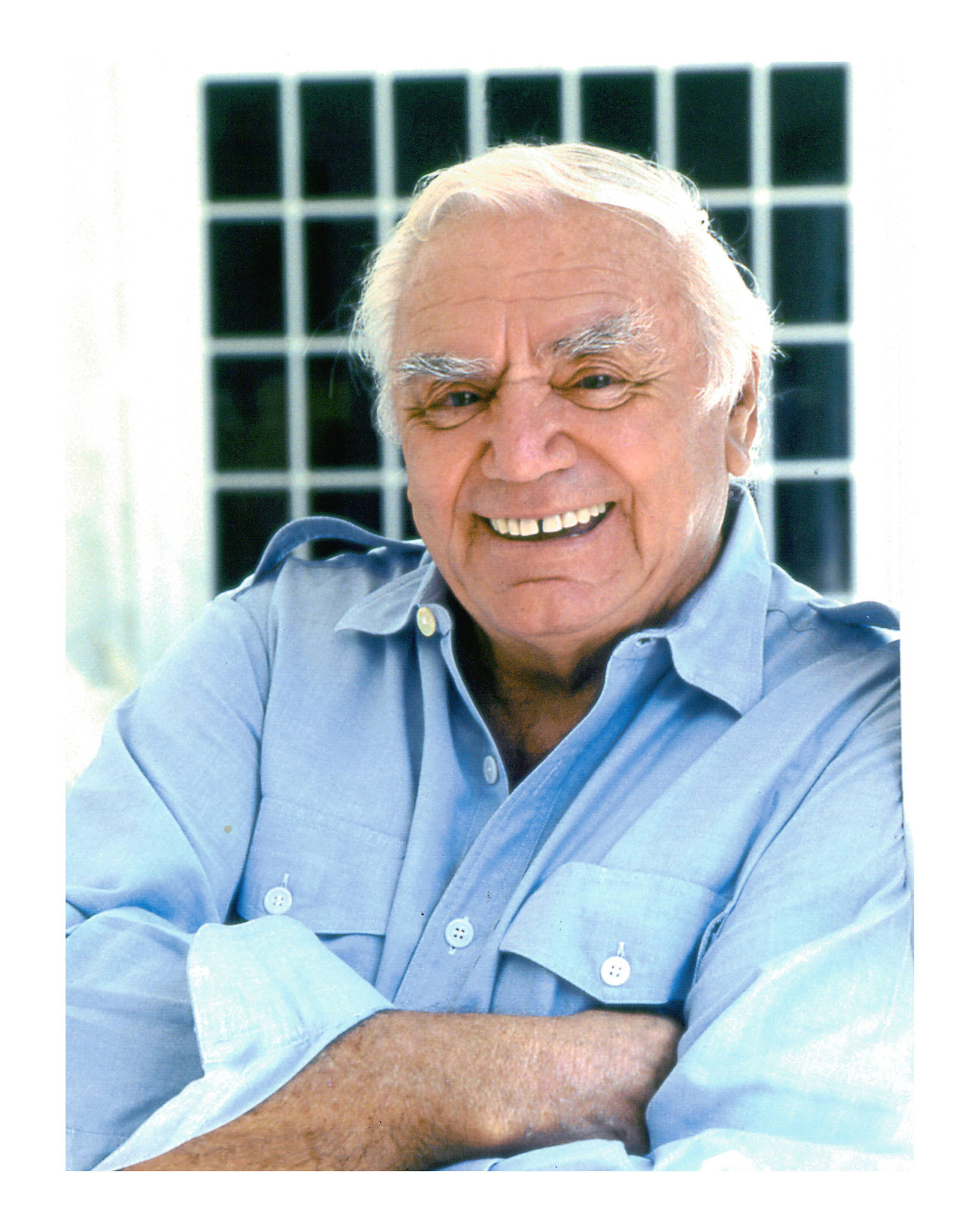 Iconic Actor Ernest Borgnine In A Blue Shirt. Background