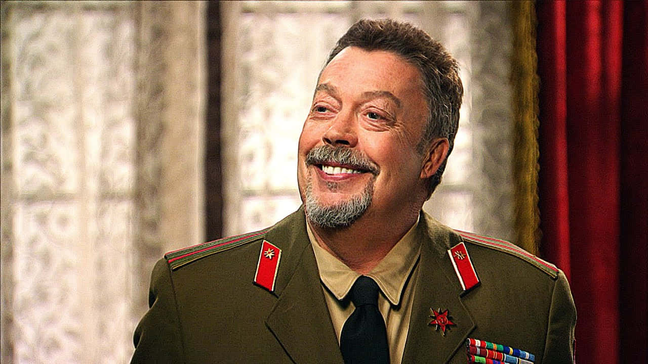 Iconic Actor Tim Curry In A Close-up Portrait Background