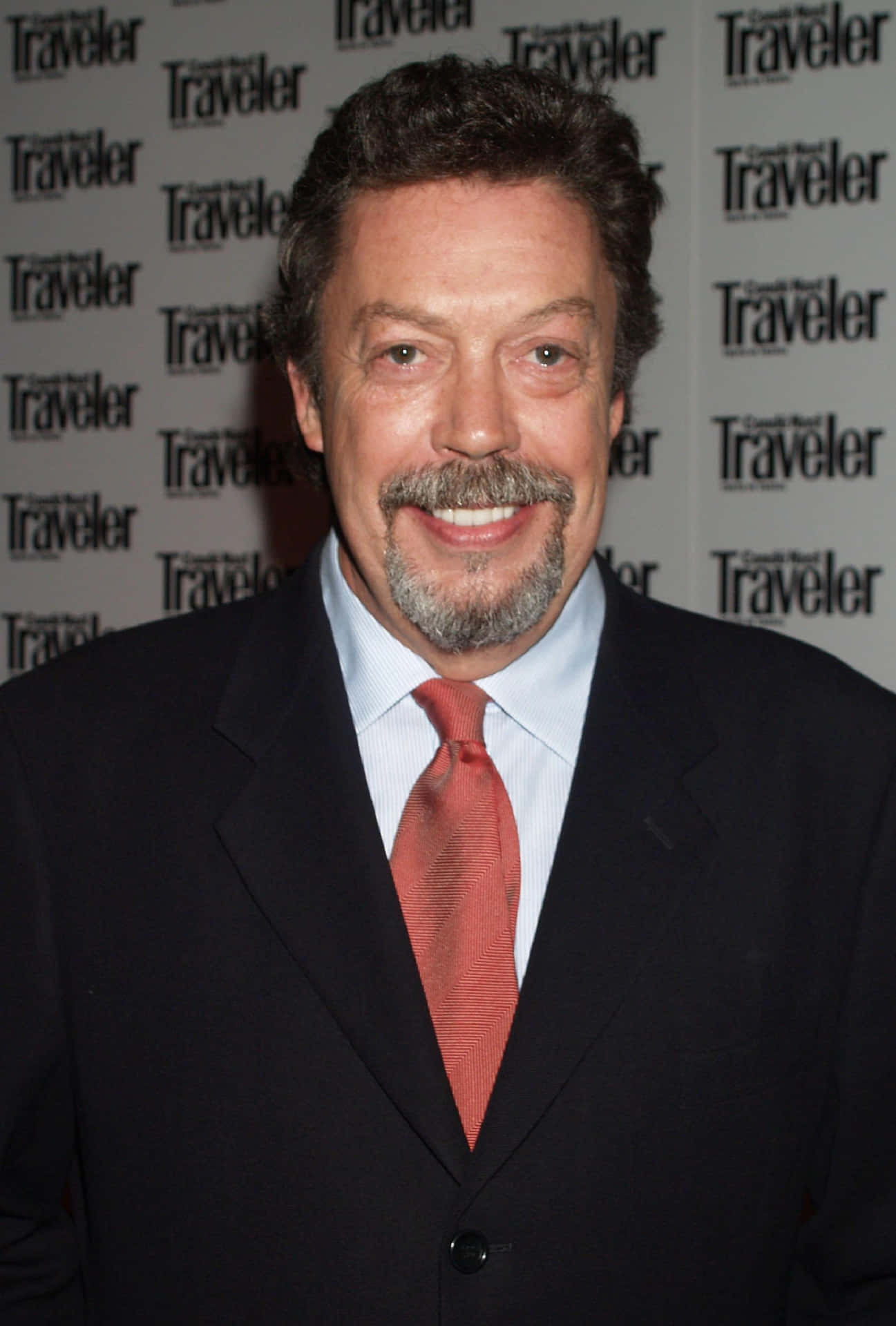 Iconic Actor Tim Curry In Classic Portrait Background