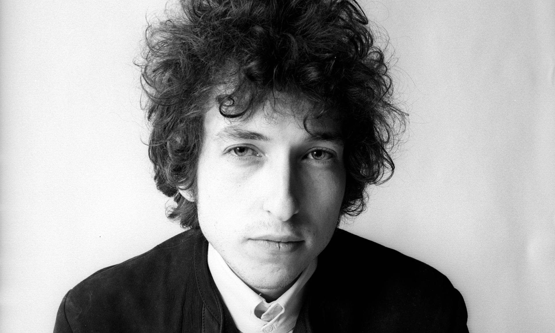 Iconic Black And White Portrait Of Renowned Musician Bob Dylan Background