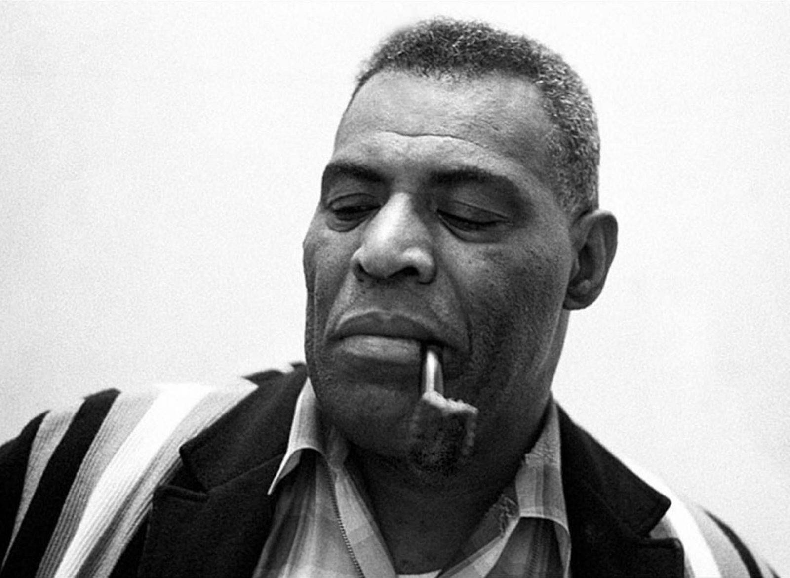 Iconic Blues Singer Howlin' Wolf Enjoying A Pipe Background